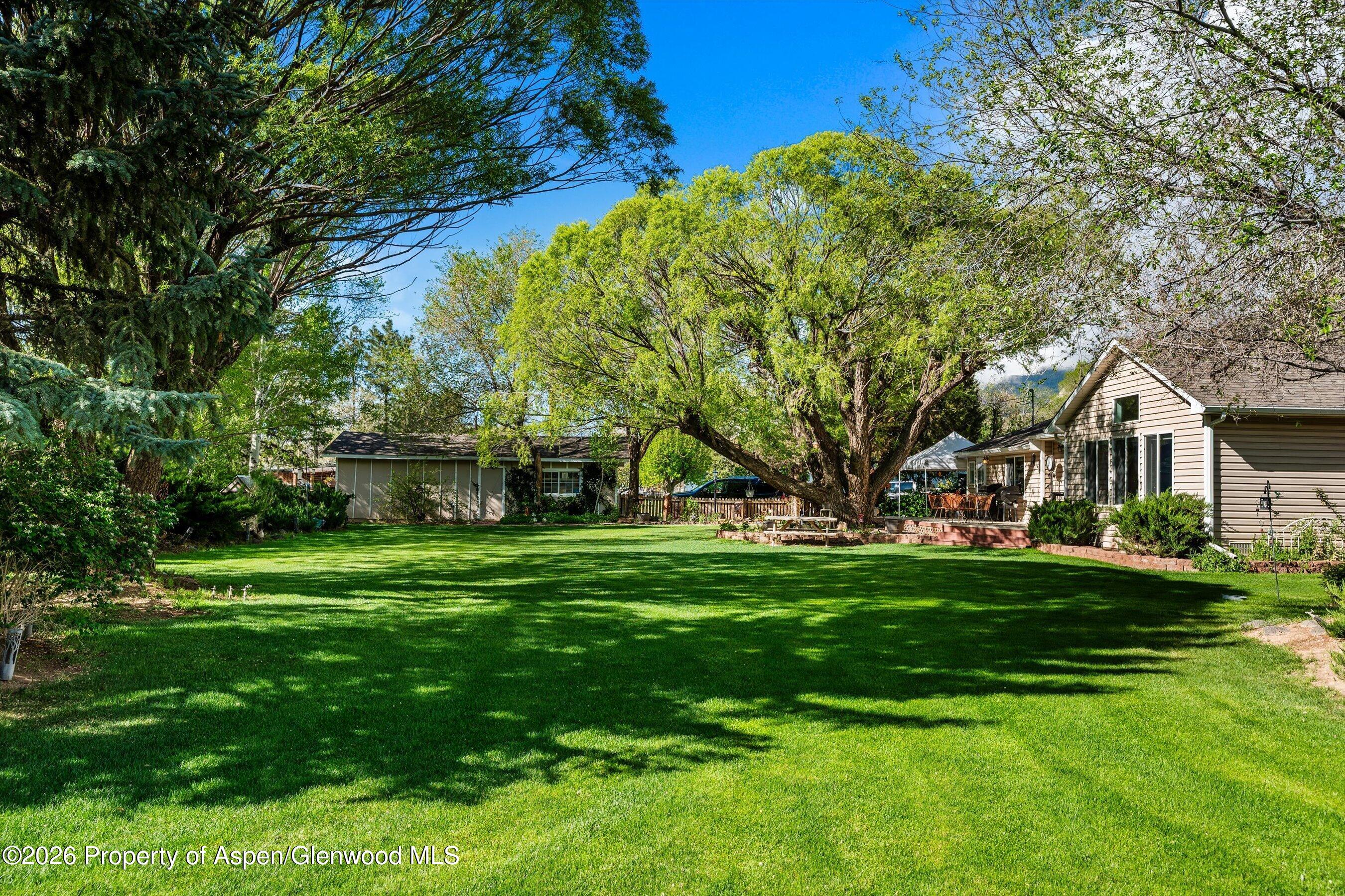 127 Cardinal Way Parachute, CO 81635 - Photo 34 of 41 a front view of a house with a garden