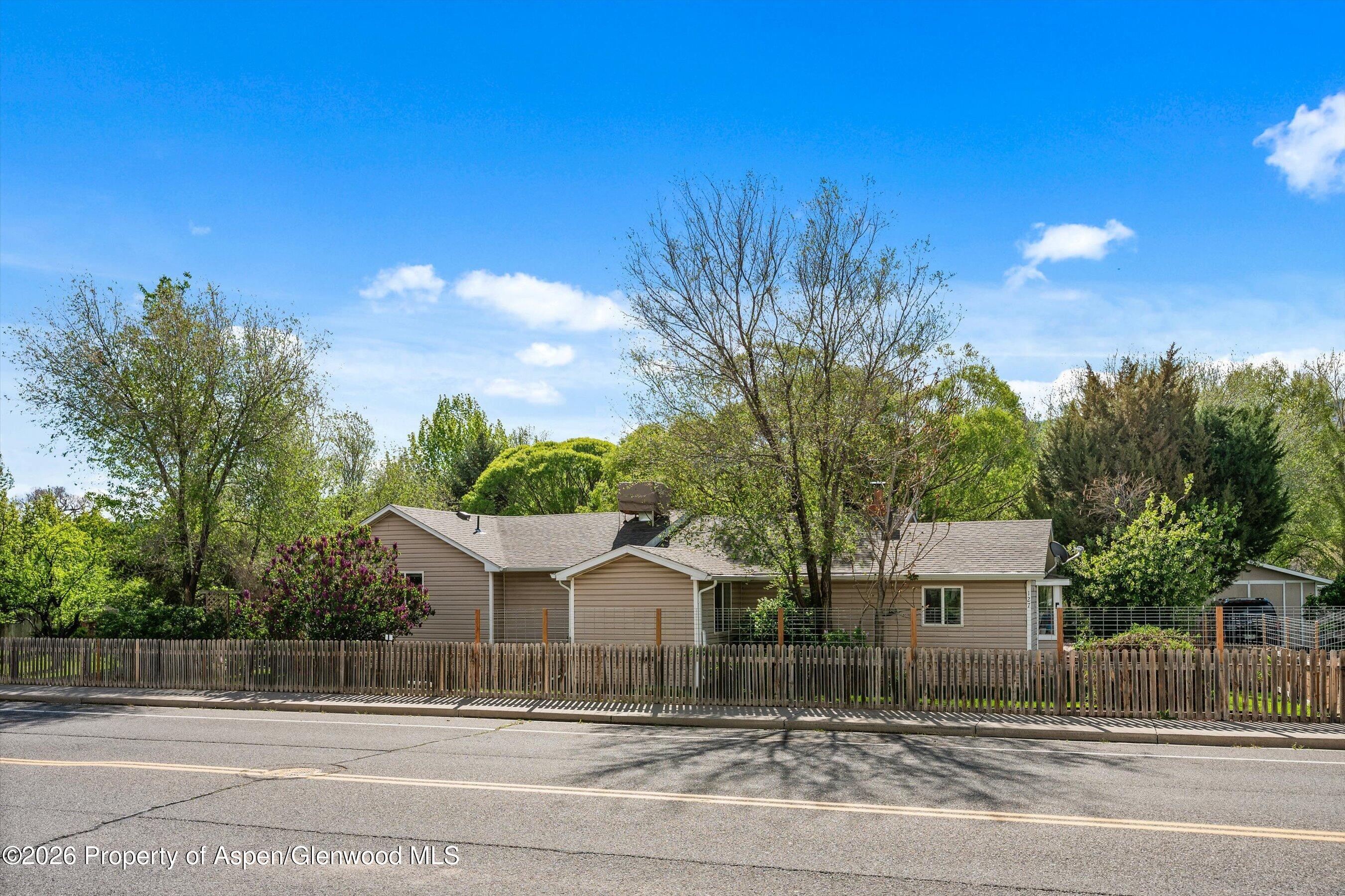 127 Cardinal Way Parachute, CO 81635 - Photo 40 of 41 a front view of a house with a garden