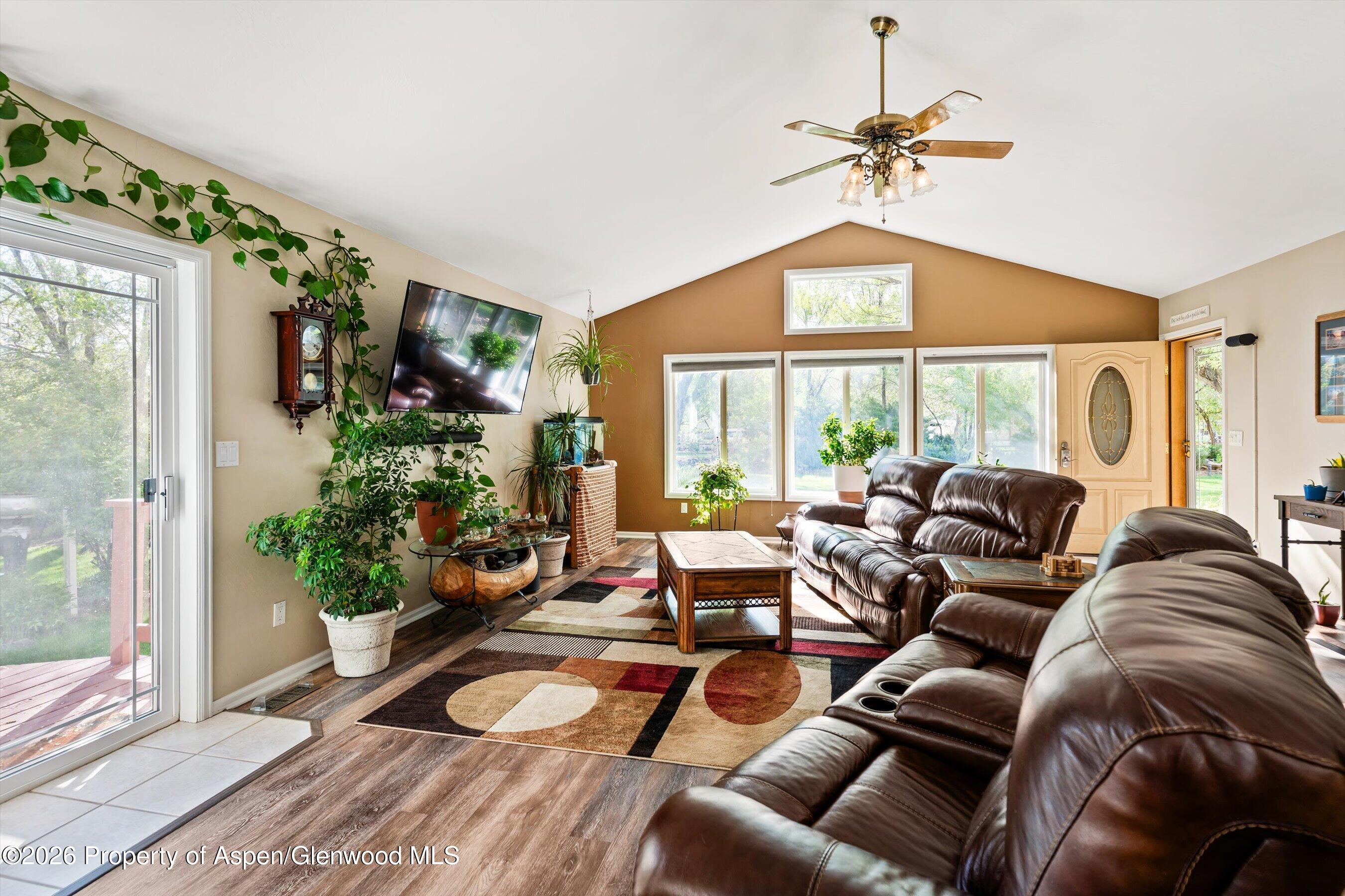 127 Cardinal Way Parachute, CO 81635 - Photo 9 of 41 a living room with furniture a chandelier and a window
