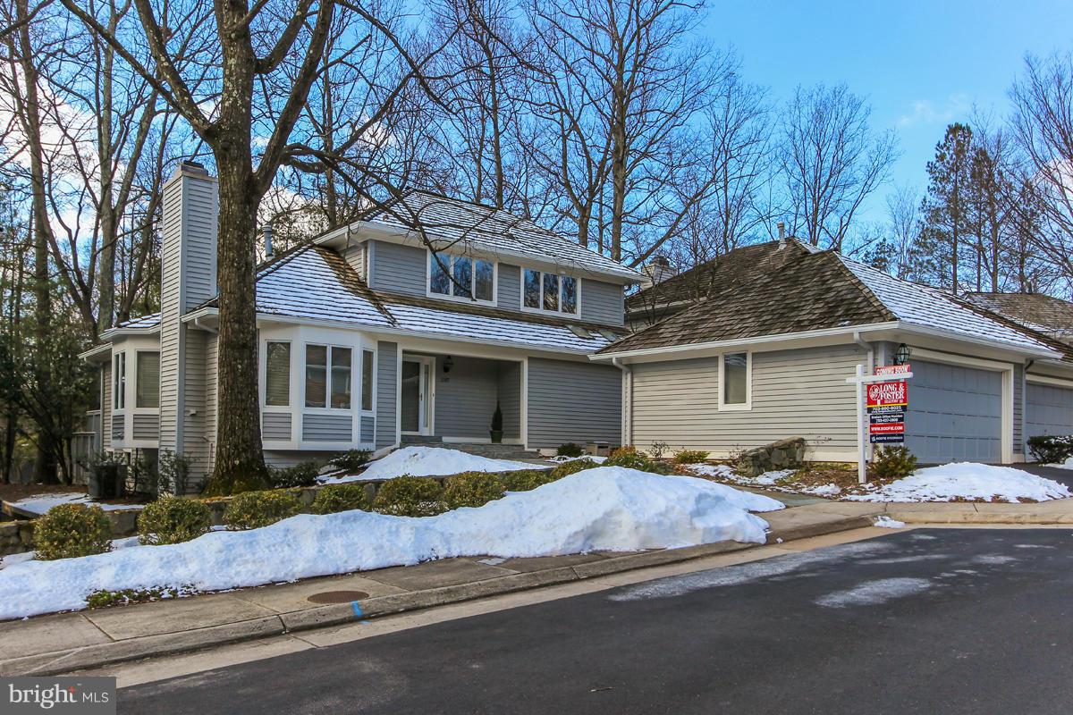 1587 Regatta Lane Reston, VA 20194 - Photo 1 of 30 a front view of a house with yard