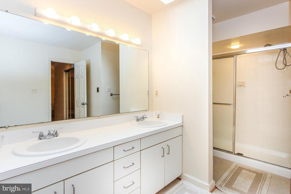 1587 Regatta Lane Reston, VA 20194 - Photo 15 of 30 a bathroom with a double vanity sink mirror and double