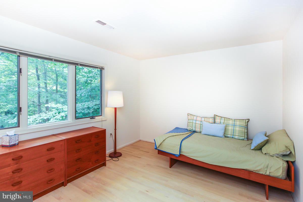 1587 Regatta Lane Reston, VA 20194 - Photo 19 of 30 a bedroom with a bed and window