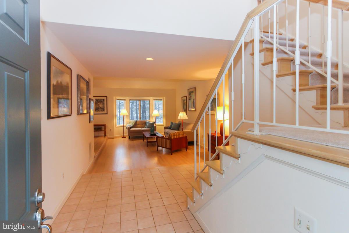 1587 Regatta Lane Reston, VA 20194 - Photo 3 of 30 a living room with furniture and a floor to ceiling window