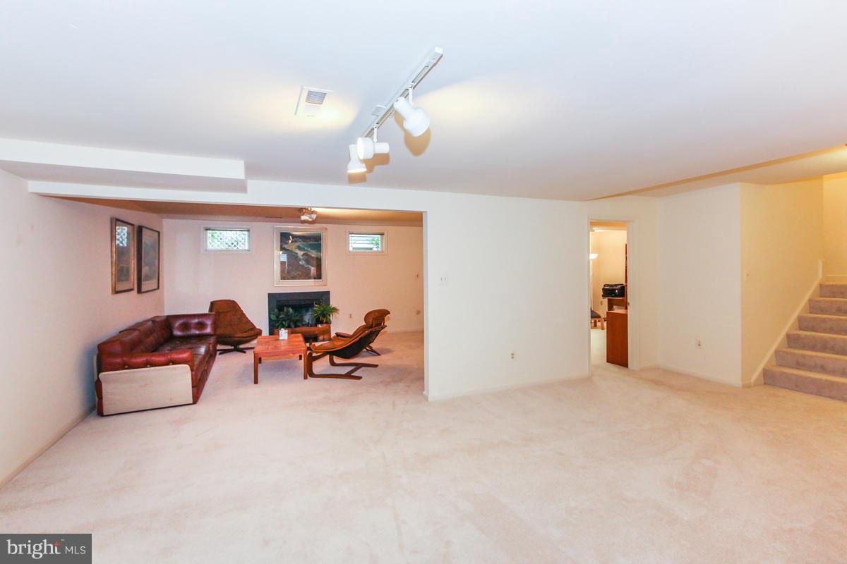 1587 Regatta Lane Reston, VA 20194 - Photo 22 of 30 a living room with furniture and a window