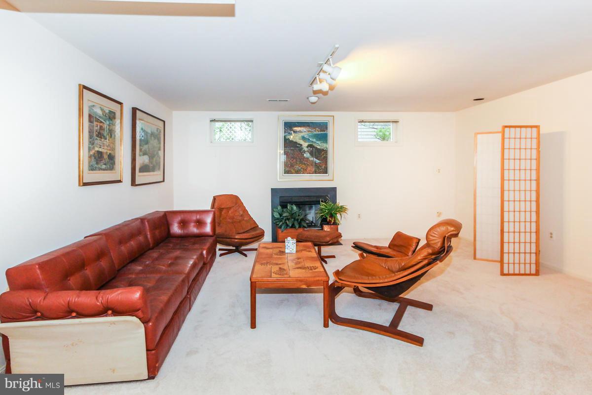 1587 Regatta Lane Reston, VA 20194 - Photo 23 of 30 a living room with furniture and a window