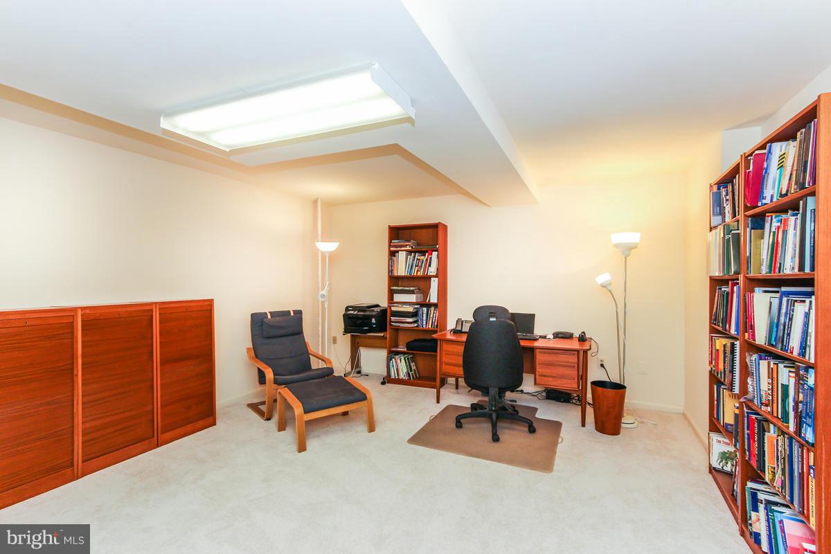 1587 Regatta Lane Reston, VA 20194 - Photo 24 of 30 a room with furniture and book shelf