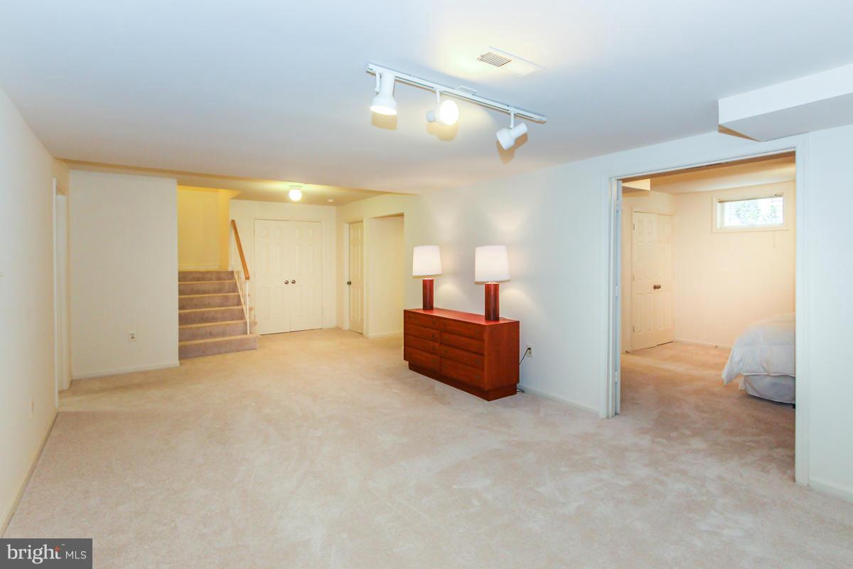 1587 Regatta Lane Reston, VA 20194 - Photo 25 of 30 a view of a room with a sink and a mirror