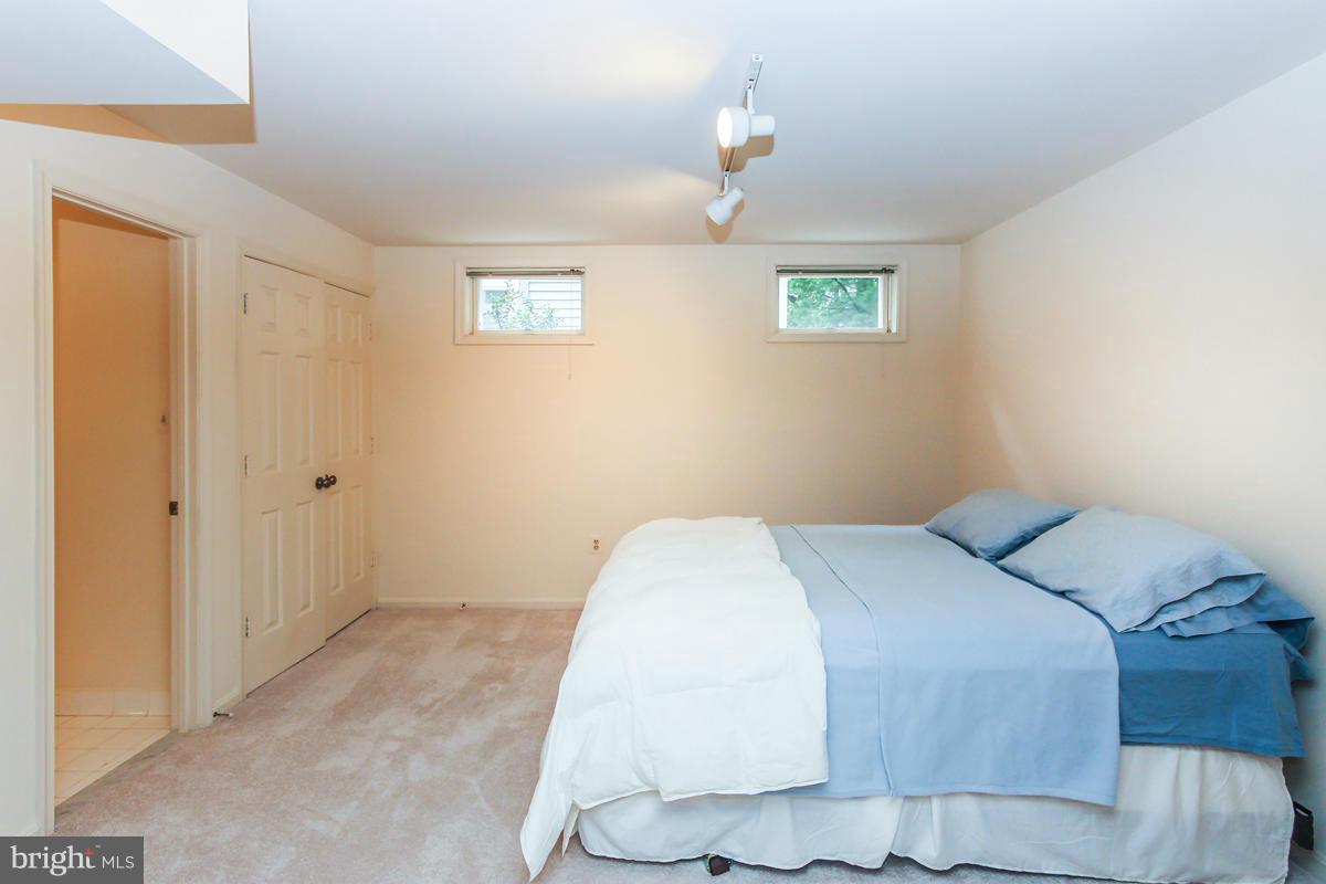 1587 Regatta Lane Reston, VA 20194 - Photo 26 of 30 a bedroom with a bed and a window