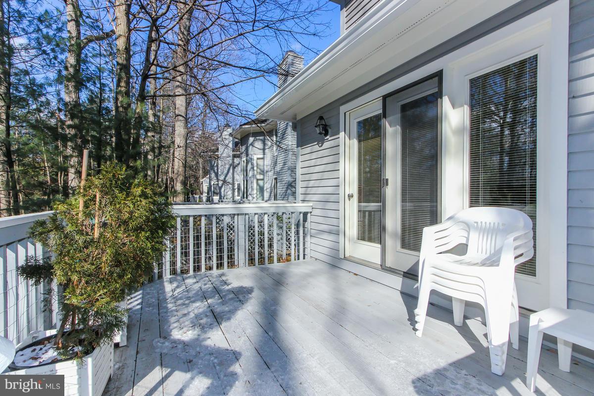 1587 Regatta Lane Reston, VA 20194 - Photo 27 of 30 a view of a chair and table in the balcony