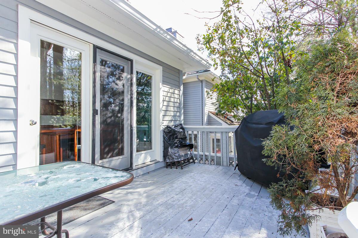 1587 Regatta Lane Reston, VA 20194 - Photo 28 of 30 a backyard of a house with outdoor seating