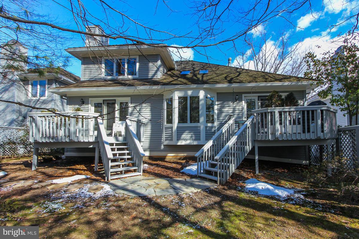 1587 Regatta Lane Reston, VA 20194 - Photo 29 of 30 a view of a house with a wooden deck