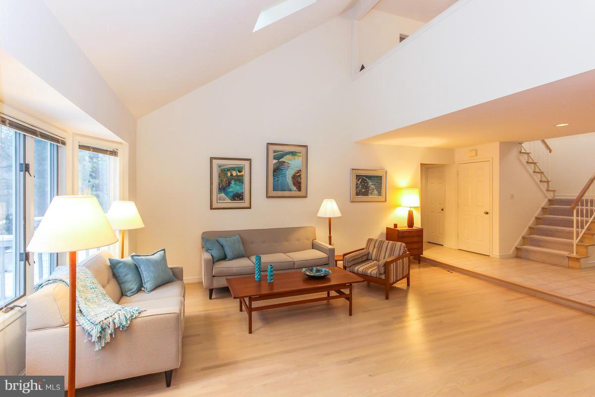 1587 Regatta Lane Reston, VA 20194 - Photo 5 of 30 a living room with furniture and a lamp
