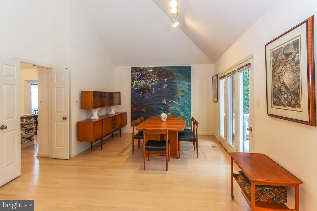 1587 Regatta Lane Reston, VA 20194 - Photo 6 of 30 a bedroom with furniture and a flat screen tv