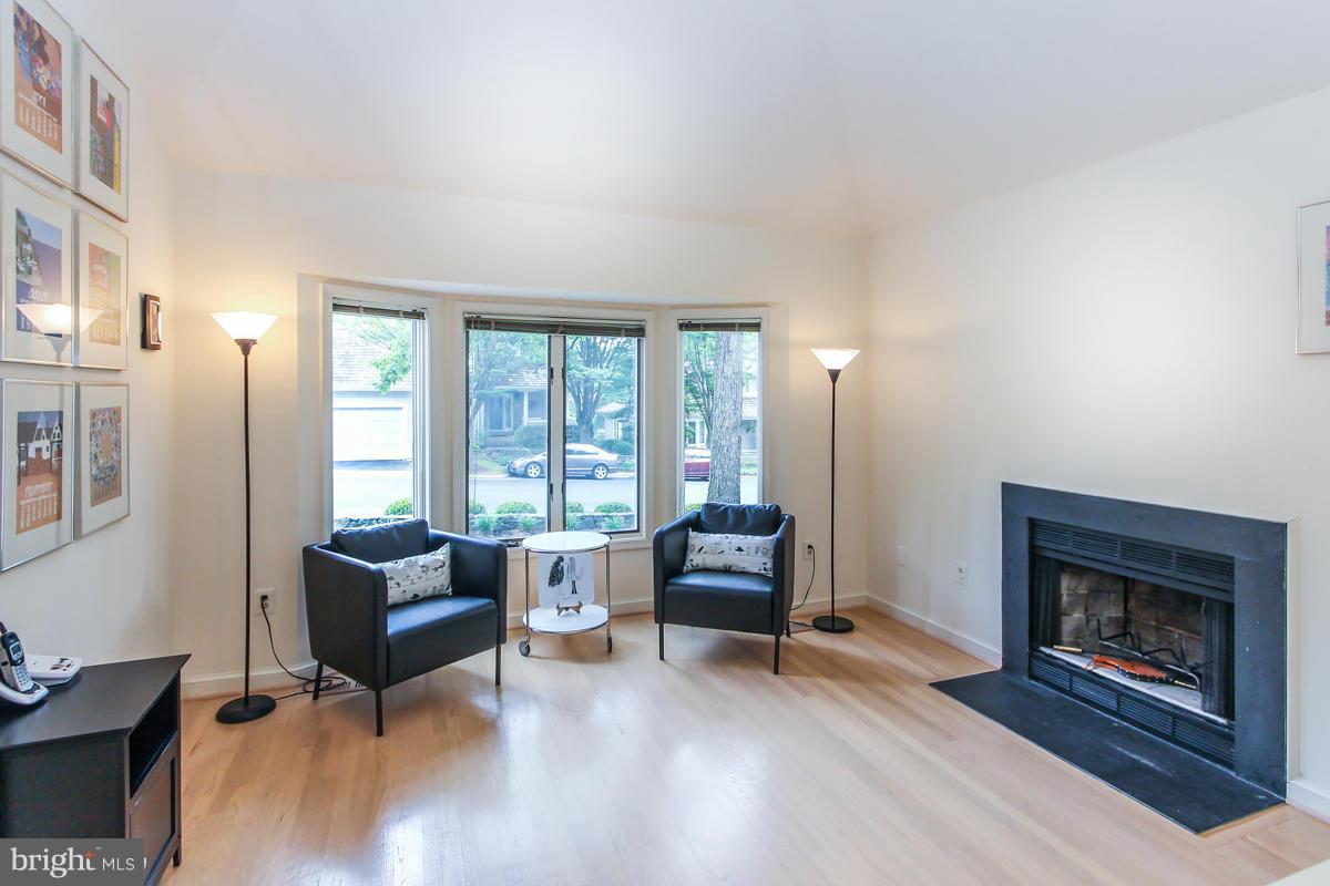 1587 Regatta Lane Reston, VA 20194 - Photo 8 of 30 a living room with furniture and a fireplace