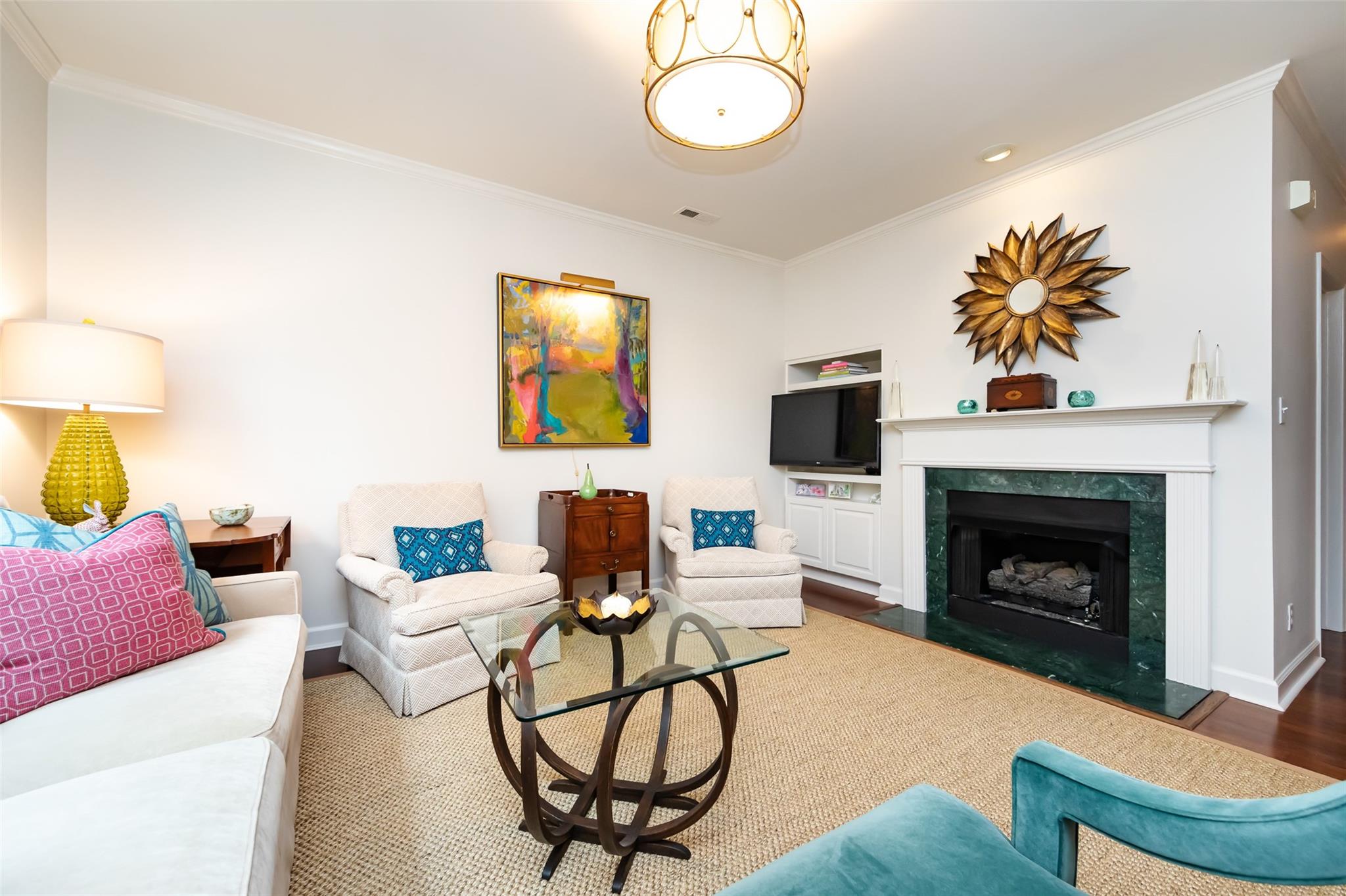 416 Queens Road, Unit 6 Charlotte, NC 28207 - Photo 12 of 37 a living room with furniture a fireplace and a flat screen tv