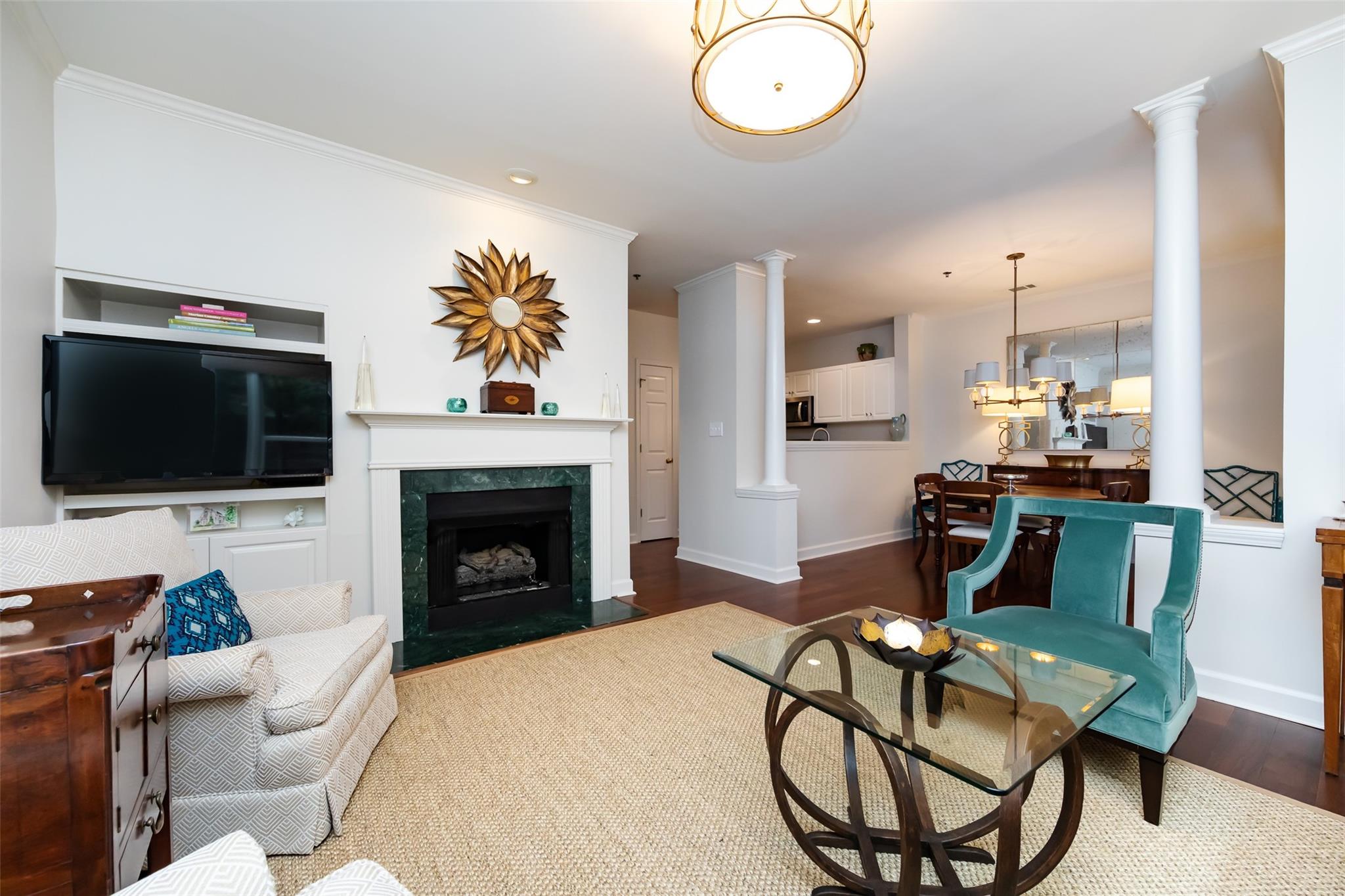 416 Queens Road, Unit 6 Charlotte, NC 28207 - Photo 13 of 37 a living room with furniture a flat screen tv and kitchen view