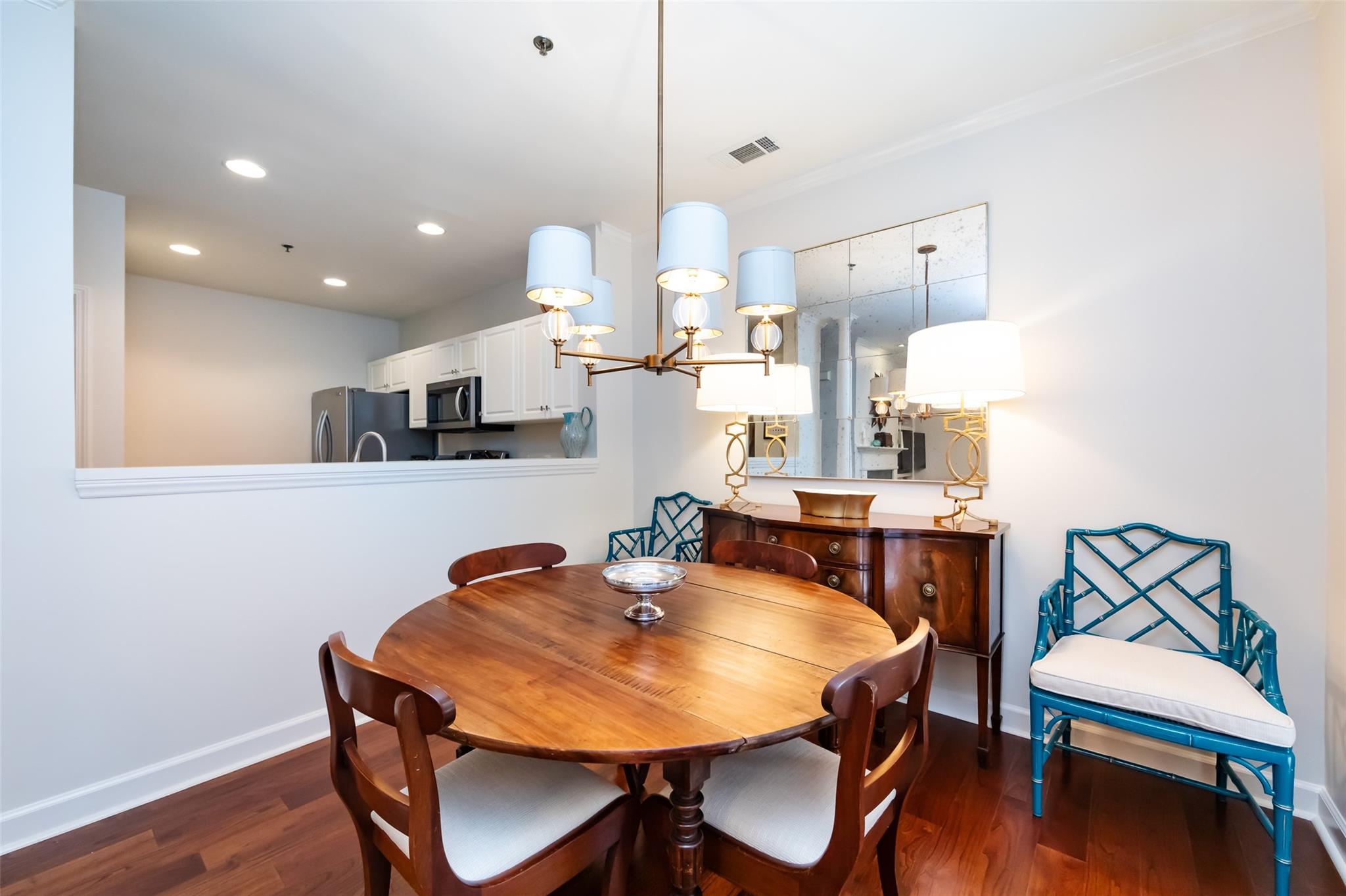416 Queens Road, Unit 6 Charlotte, NC 28207 - Photo 14 of 37 a view of a dining room with furniture and wooden floor