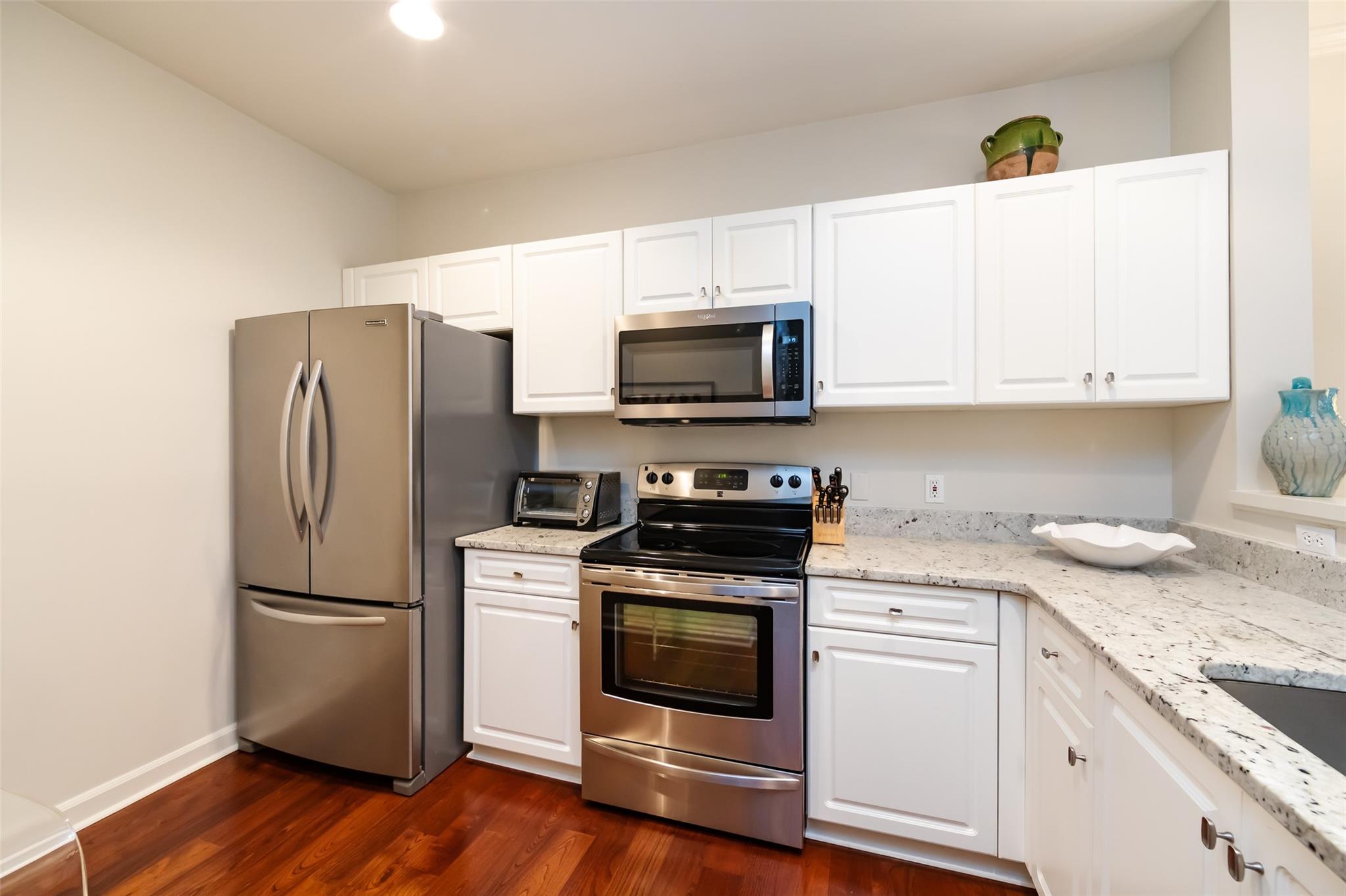 416 Queens Road, Unit 6 Charlotte, NC 28207 - Photo 19 of 37 a kitchen with a sink stove and refrigerator
