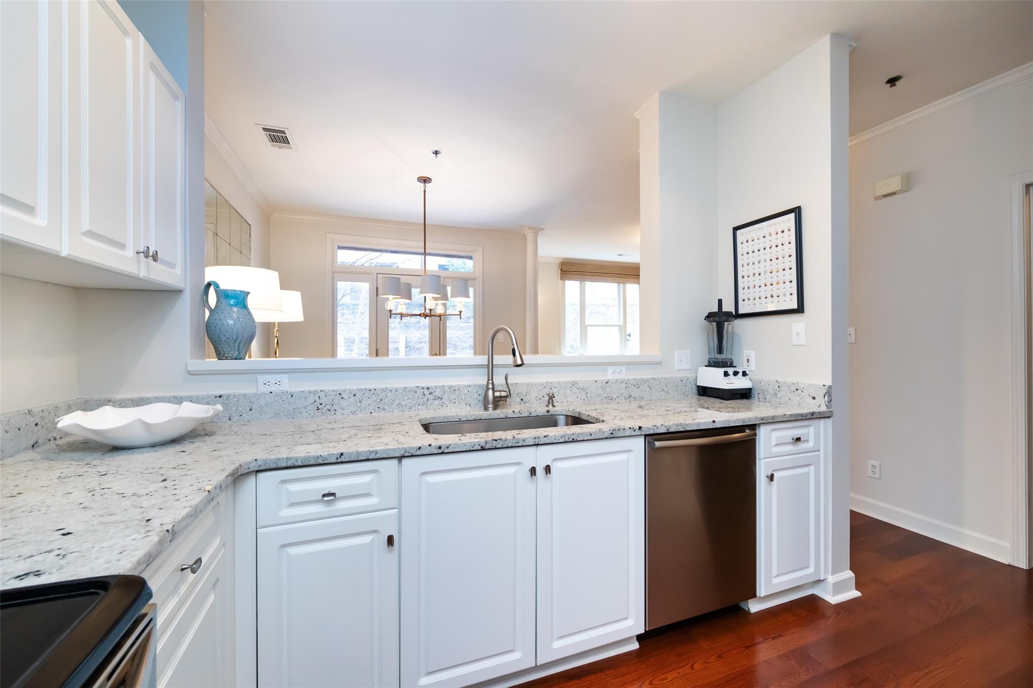 416 Queens Road, Unit 6 Charlotte, NC 28207 - Photo 21 of 37 a kitchen with a sink stove and cabinets