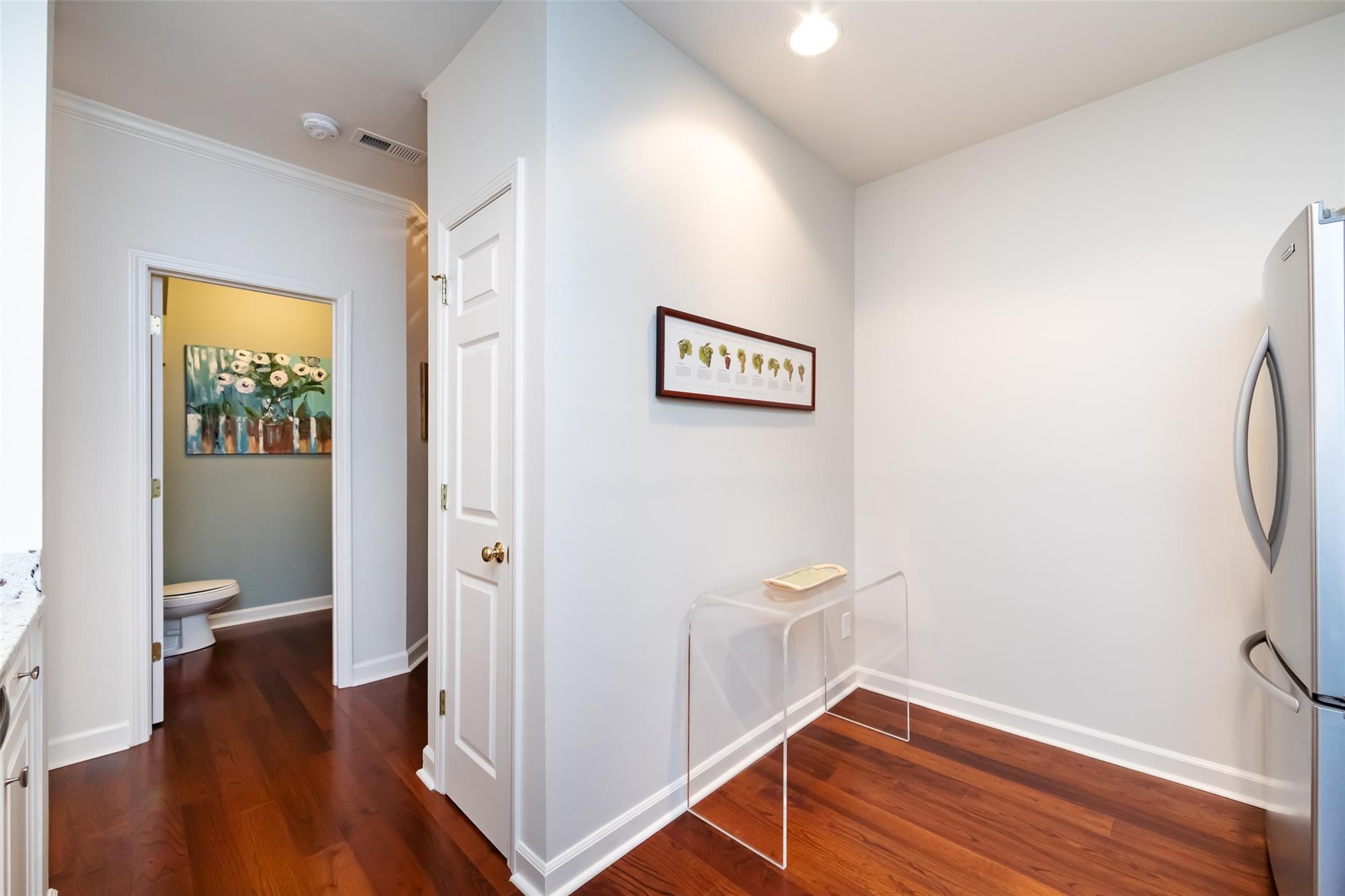 416 Queens Road, Unit 6 Charlotte, NC 28207 - Photo 22 of 37 a view of a hallway with wooden floor and a hallway