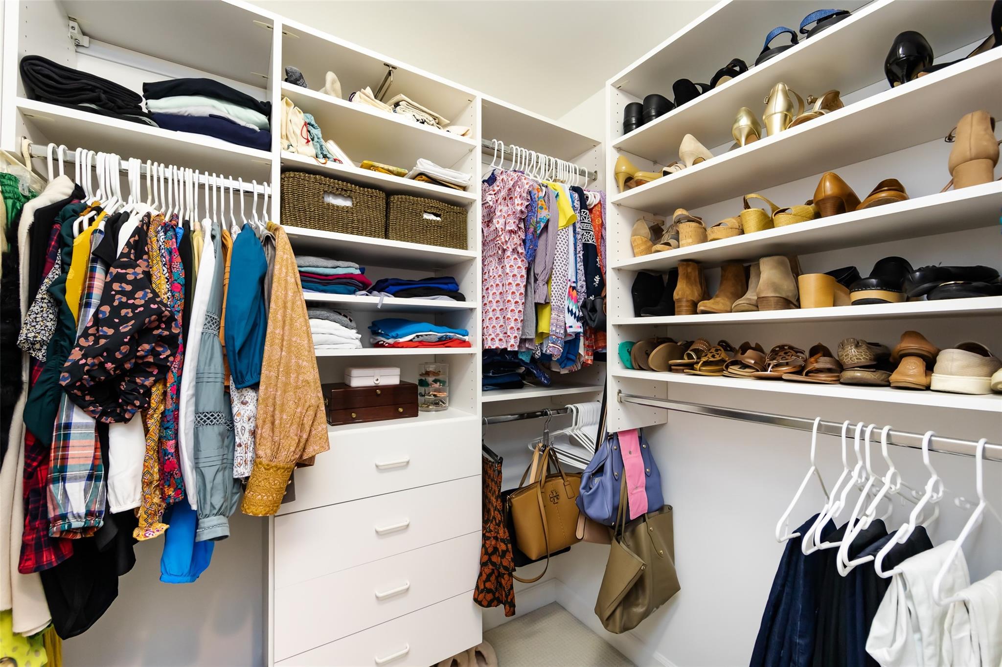 416 Queens Road, Unit 6 Charlotte, NC 28207 - Photo 29 of 37 a view of walk in closet with clothes and shoes