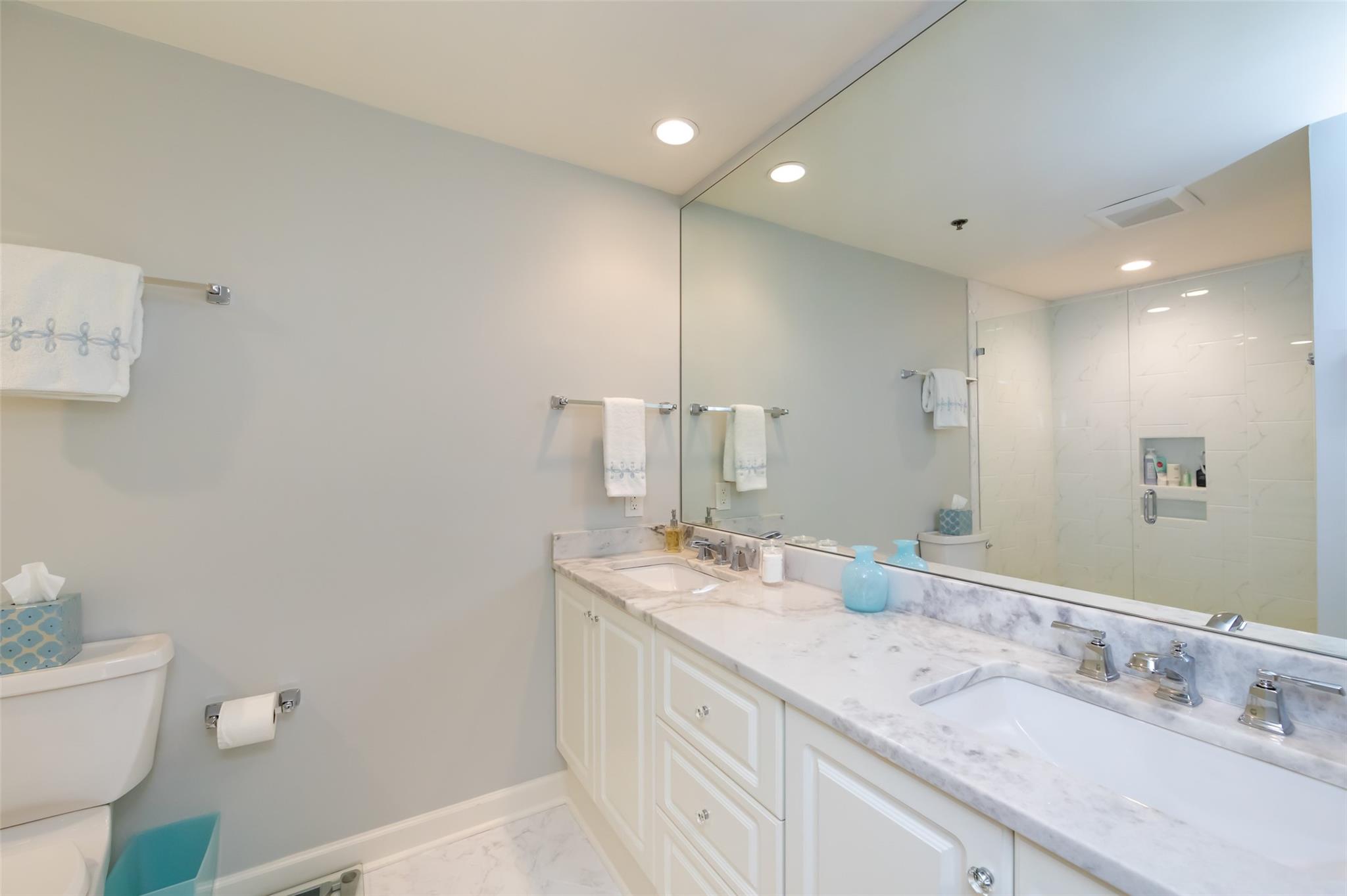 416 Queens Road, Unit 6 Charlotte, NC 28207 - Photo 30 of 37 a bathroom with a double vanity sink and a mirror