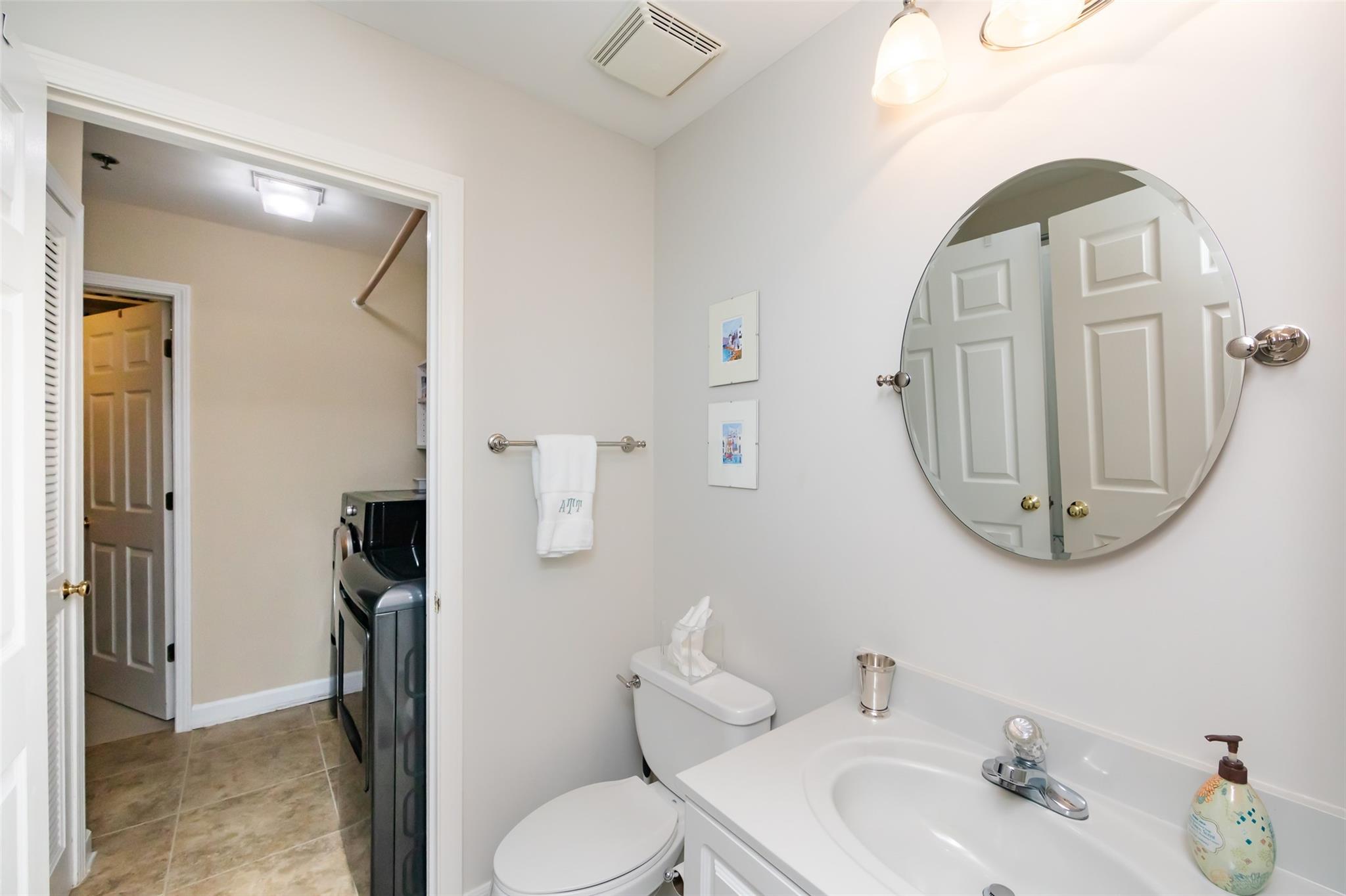 416 Queens Road, Unit 6 Charlotte, NC 28207 - Photo 33 of 37 a bathroom with a sink a toilet and a mirror