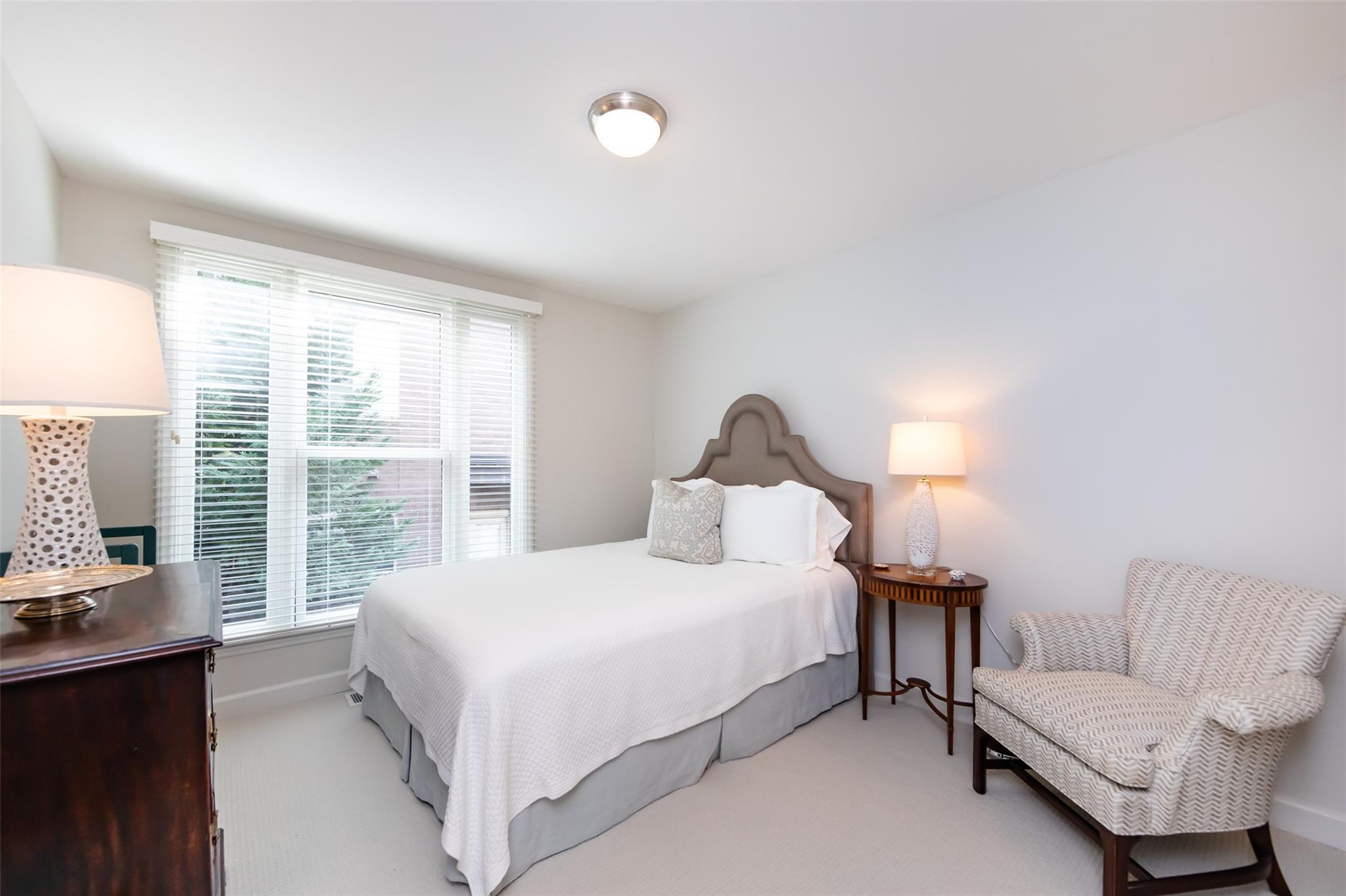 416 Queens Road, Unit 6 Charlotte, NC 28207 - Photo 34 of 37 a bedroom with a bed and a couch