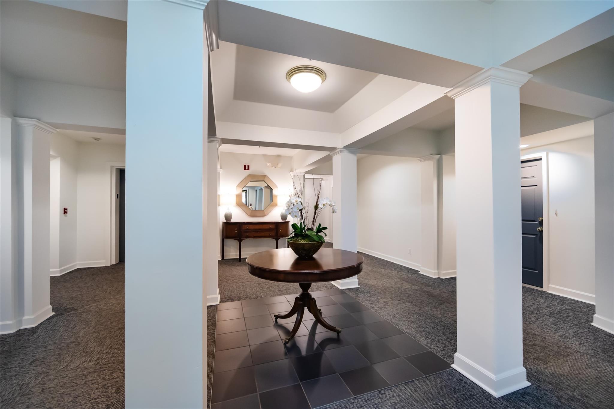 416 Queens Road, Unit 6 Charlotte, NC 28207 - Photo 4 of 37 a room with a table and chairs