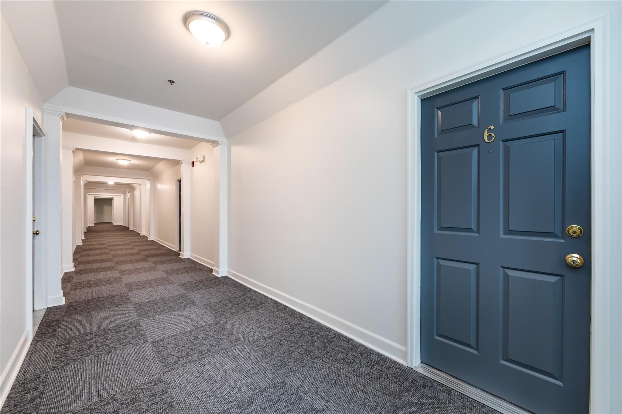 416 Queens Road, Unit 6 Charlotte, NC 28207 - Photo 5 of 37 a view of a hallway with wooden floor