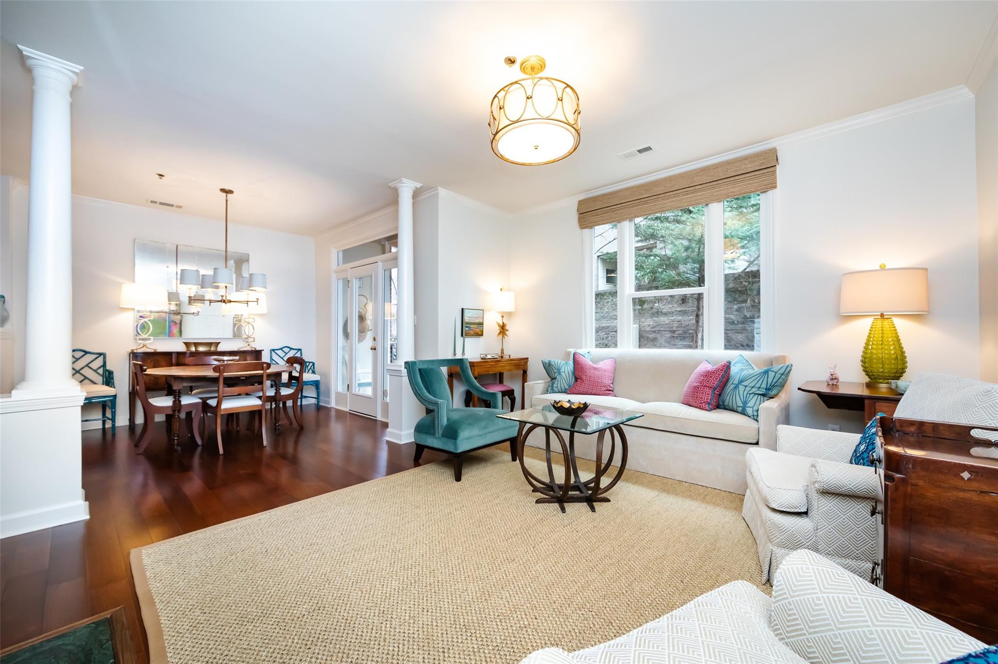 416 Queens Road, Unit 6 Charlotte, NC 28207 - Photo 10 of 37 a living room with furniture chandelier and a large window