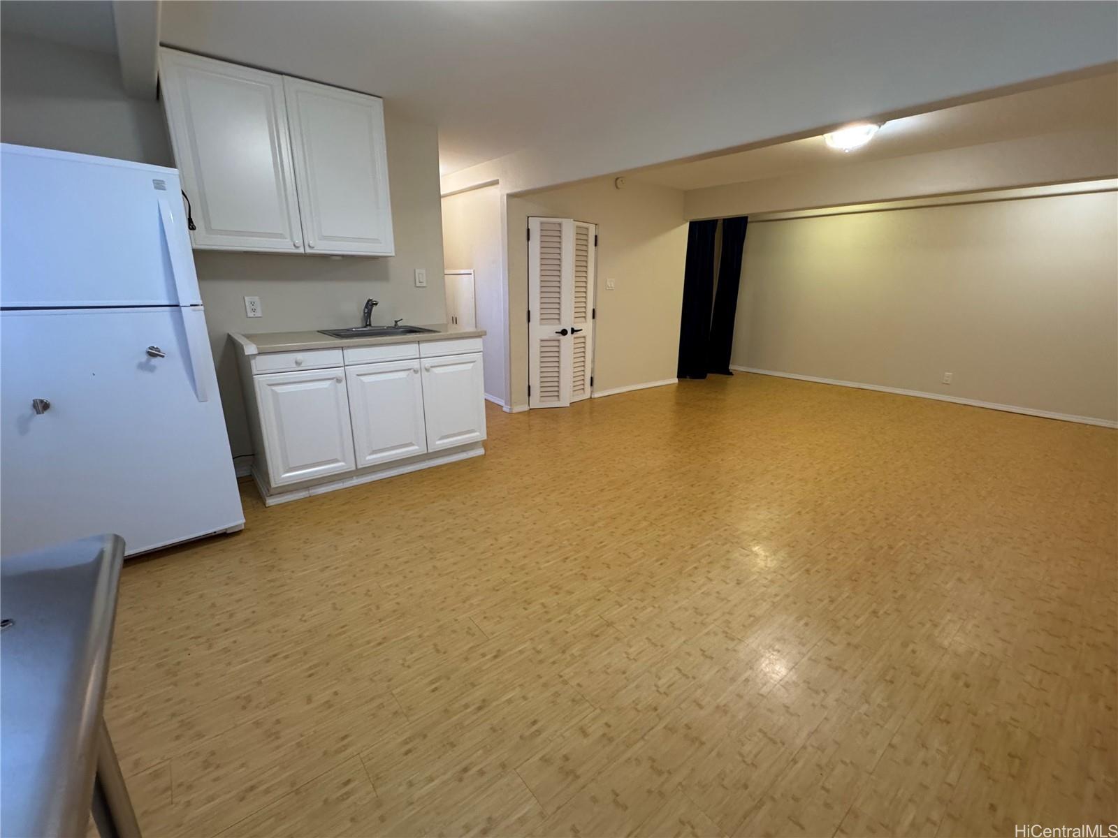 320 Hao Street Honolulu, HI 96821 - Photo 4 of 15 a view of an empty room with a kitchen