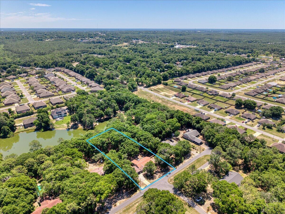 210 Shell Drive Crestview, FL 32536 - Photo 63 of 67 an aerial view of residential houses with outdoor space and trees