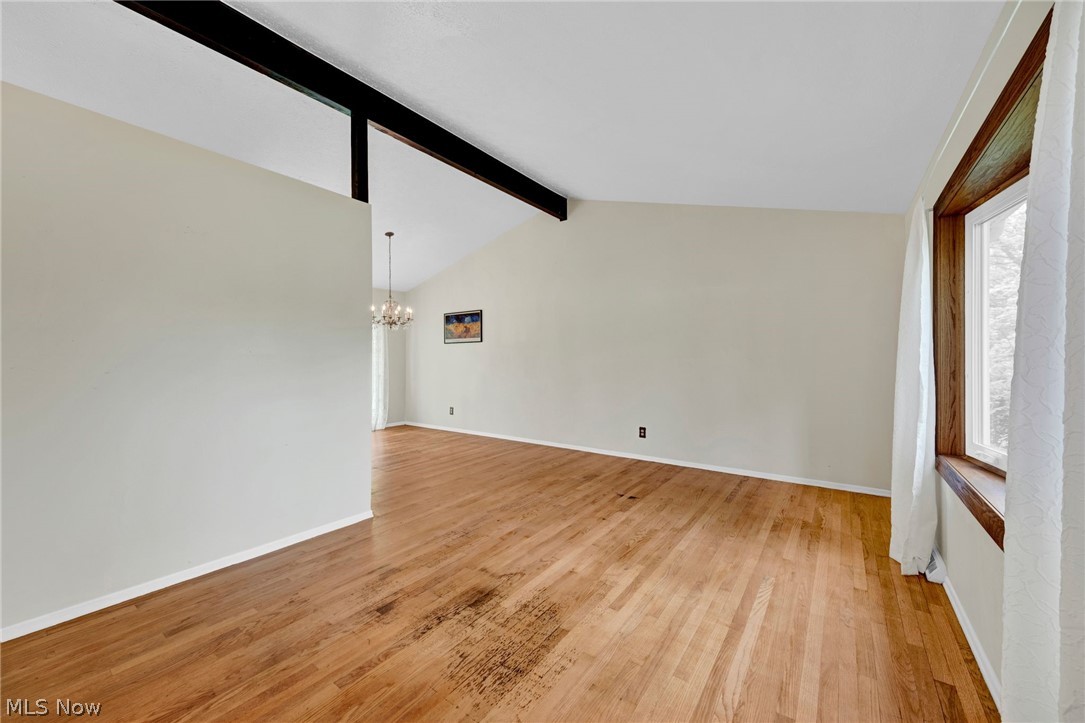 8451 Valley View Road Macedonia, OH 44056 - Photo 6 of 31 Vaulted living room w new bay window and beamed ceiling