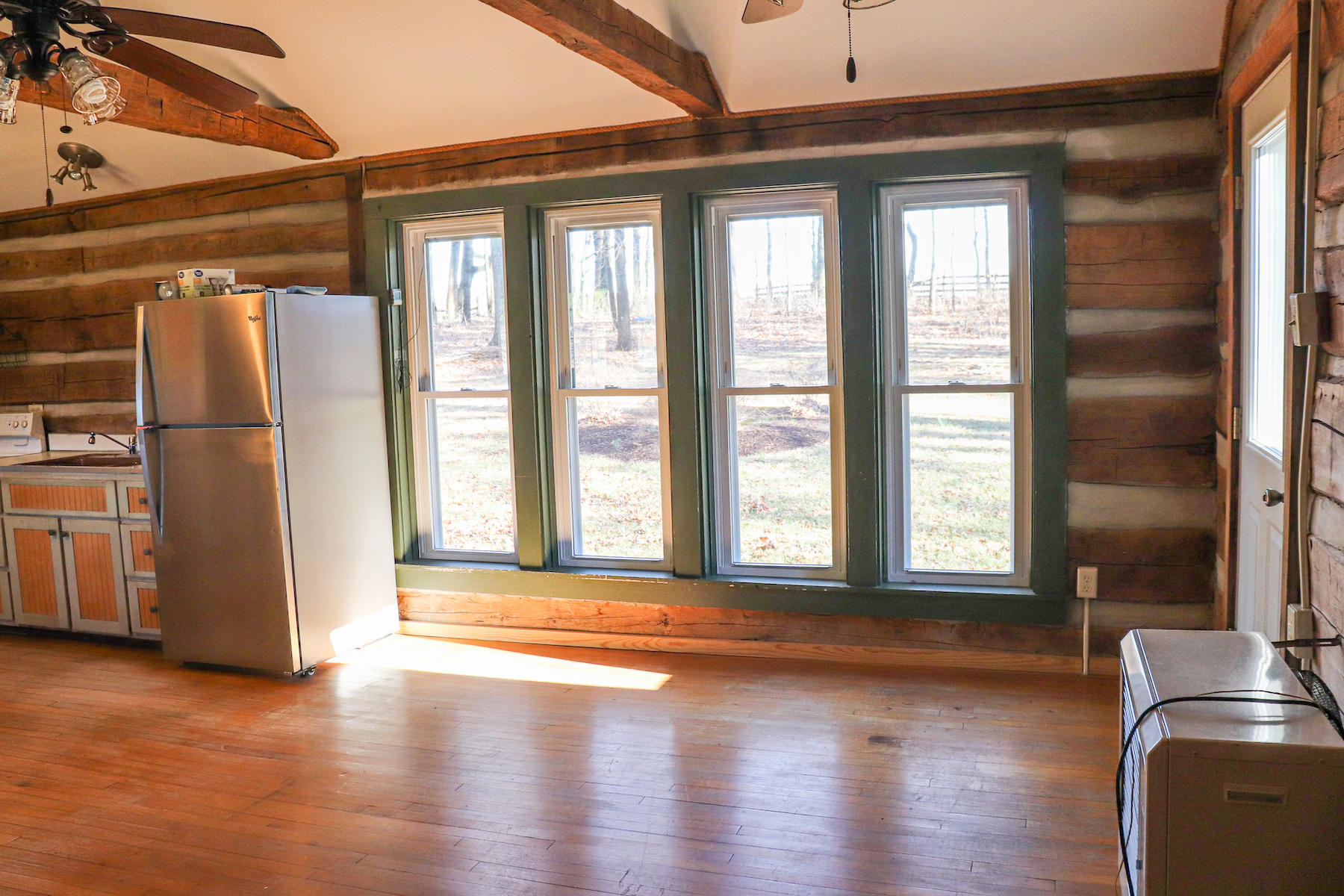 583 Alum Ridge Road Northwest Floyd, VA 24091 - Photo 5 of 22 a view of an empty room with wooden floor and a window