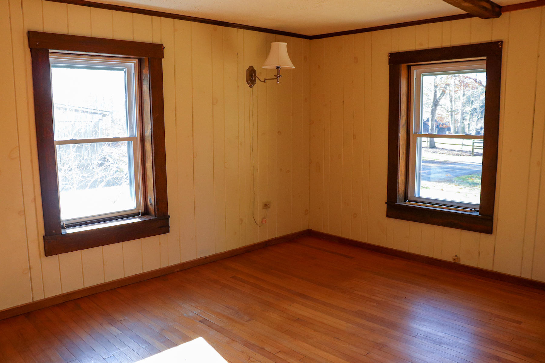 583 Alum Ridge Road Northwest Floyd, VA 24091 - Photo 6 of 22 an empty room with wooden floor and windows