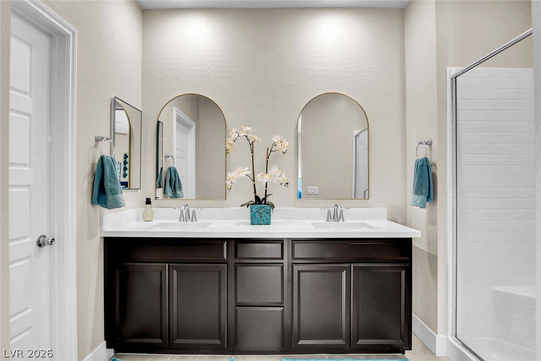 9688 Rankin Rdg Court Las Vegas, NV 89178 - Photo 38 of 53 Dual vanity sinks provide ample space in this well-appointed bathroom.