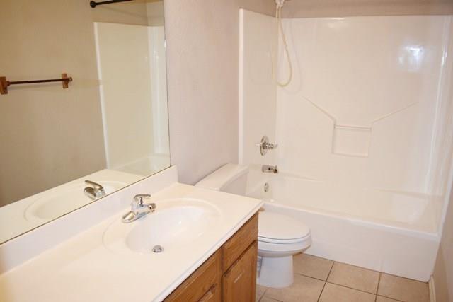 760-764 Stribling Circle Azle, TX 76020 - Photo 8 of 18 Full bath featuring vanity, bathing tub / shower combination, and light tile patterned floors