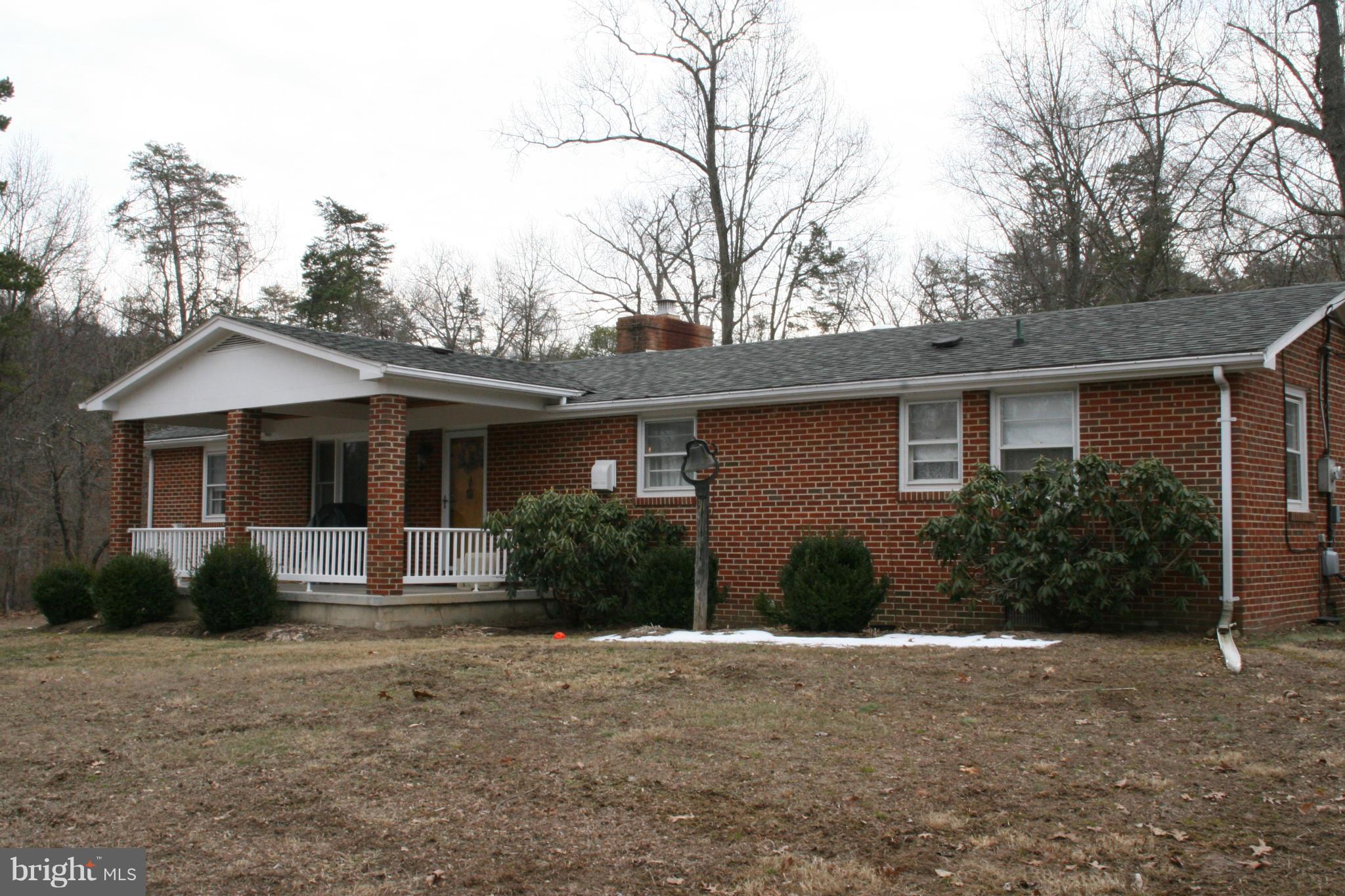 6606 Howellsville Road Front Royal, VA 22630 - Photo 2 of 30 a front view of house with yard and trees around