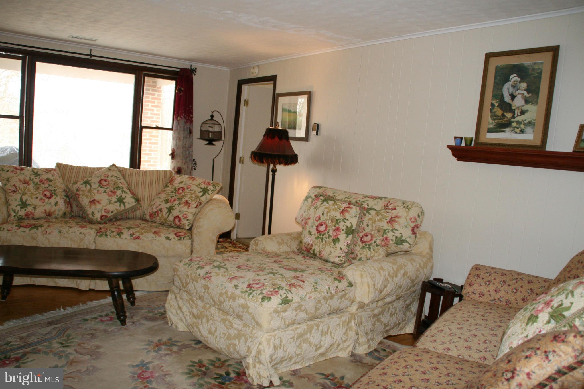 6606 Howellsville Road Front Royal, VA 22630 - Photo 11 of 30 a living room with furniture and a window