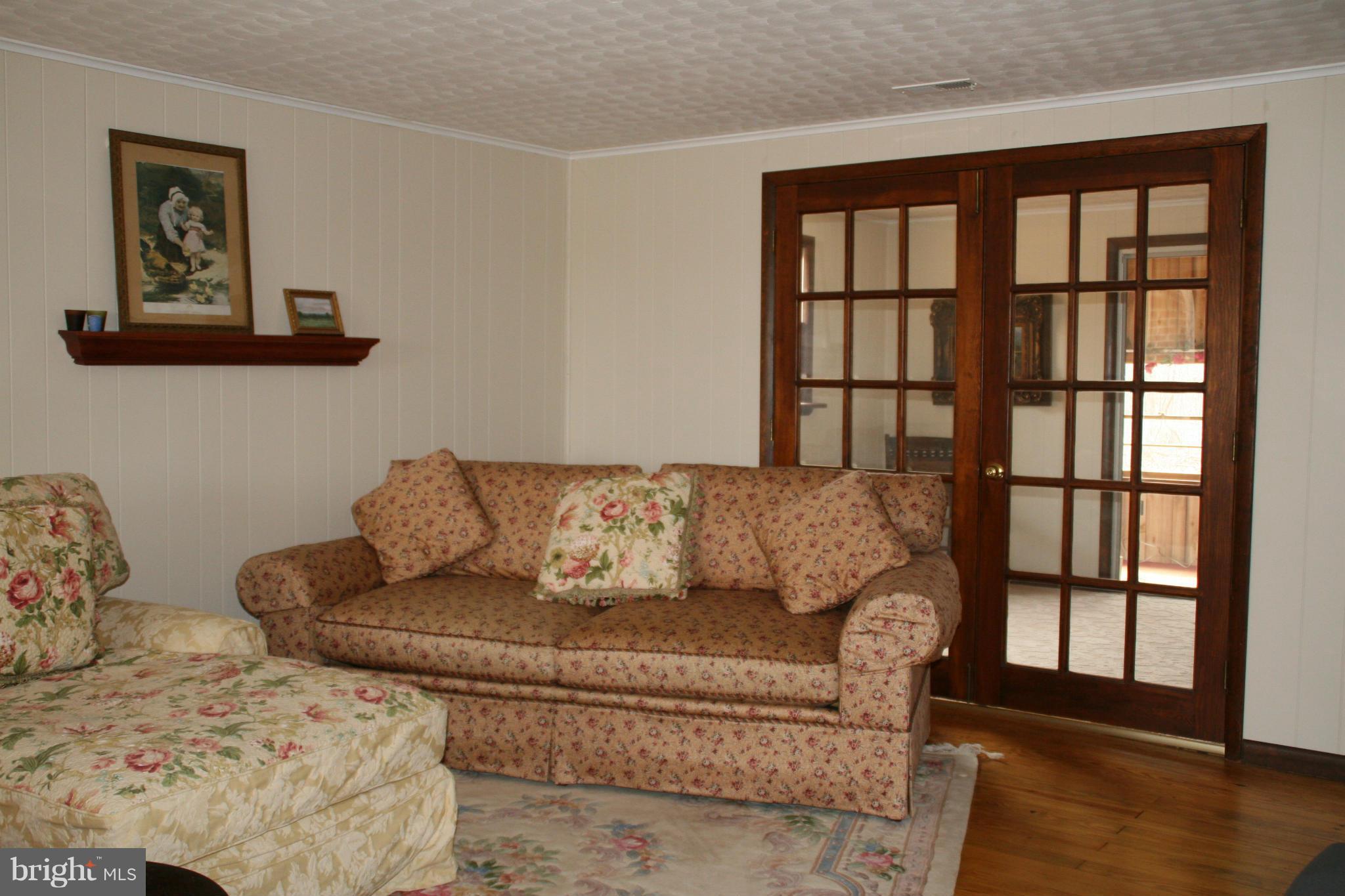 6606 Howellsville Road Front Royal, VA 22630 - Photo 12 of 30 a living room with couches and a large window with rug
