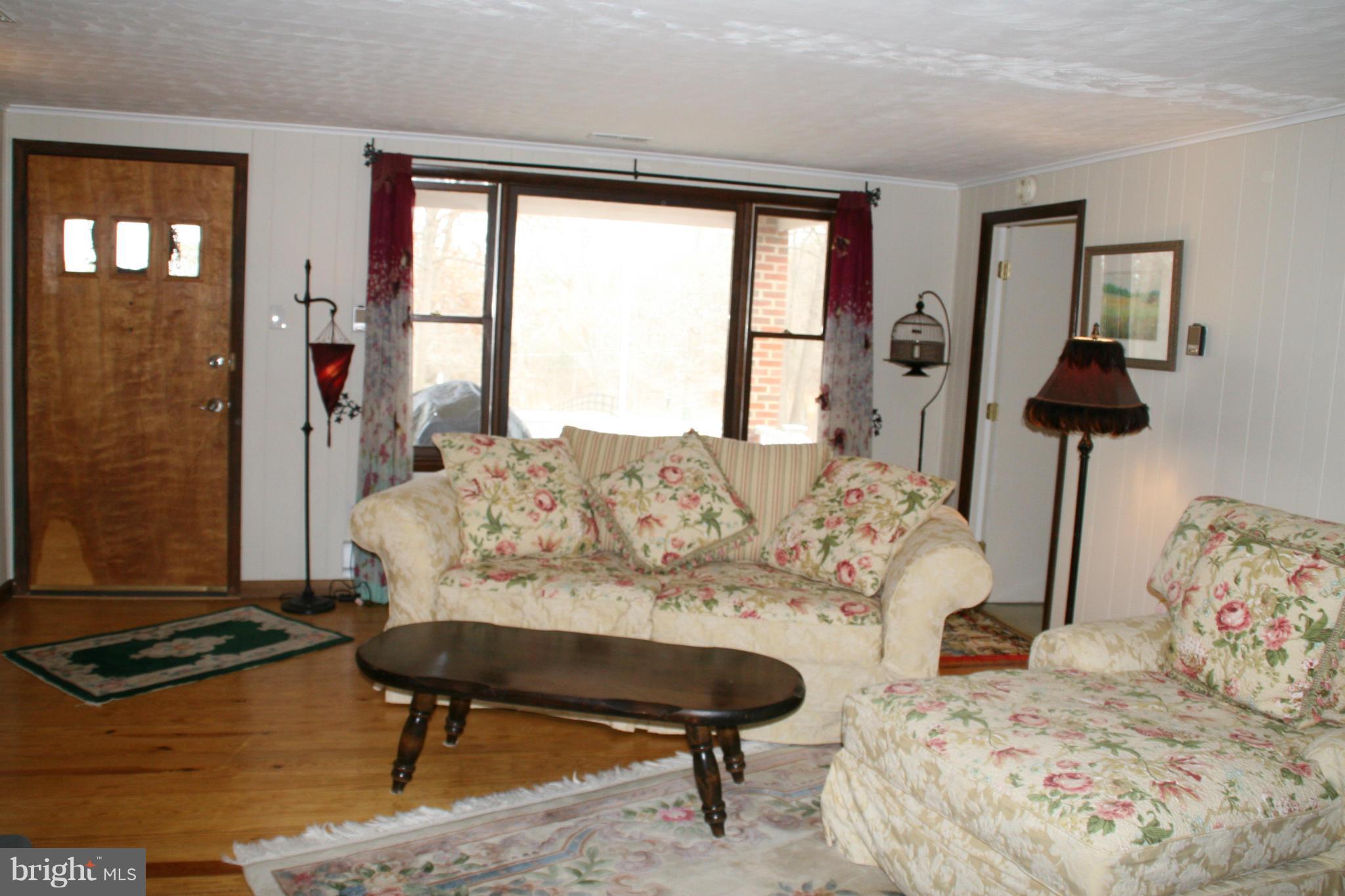 6606 Howellsville Road Front Royal, VA 22630 - Photo 13 of 30 a living room with furniture and a window