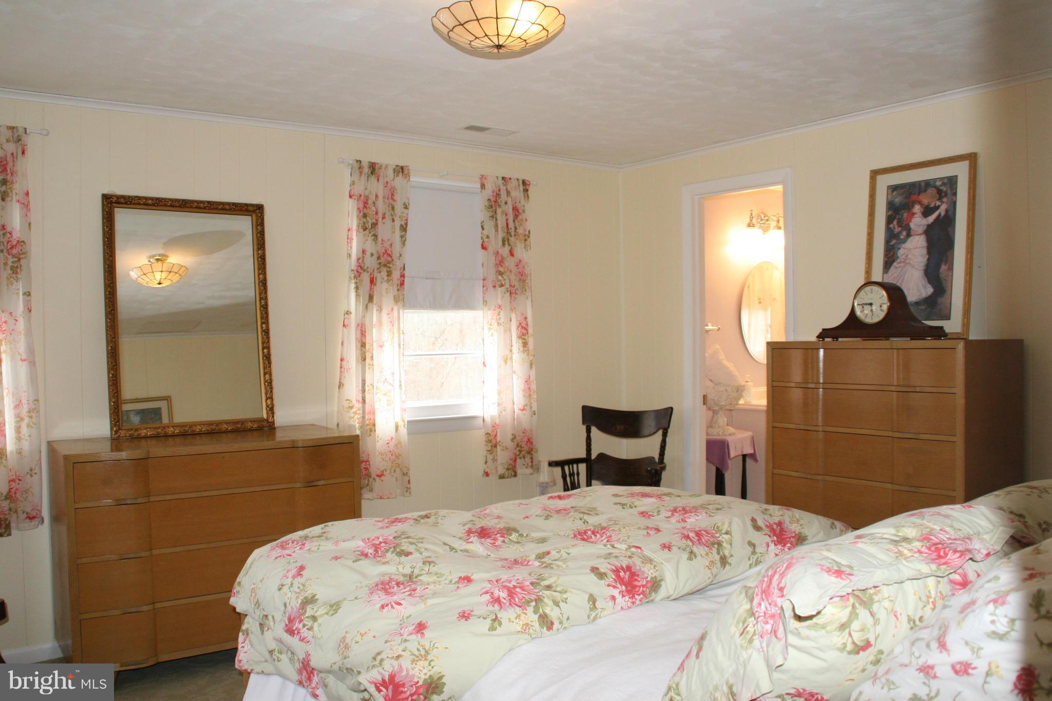 6606 Howellsville Road Front Royal, VA 22630 - Photo 14 of 30 a bedroom with a bed and dresser