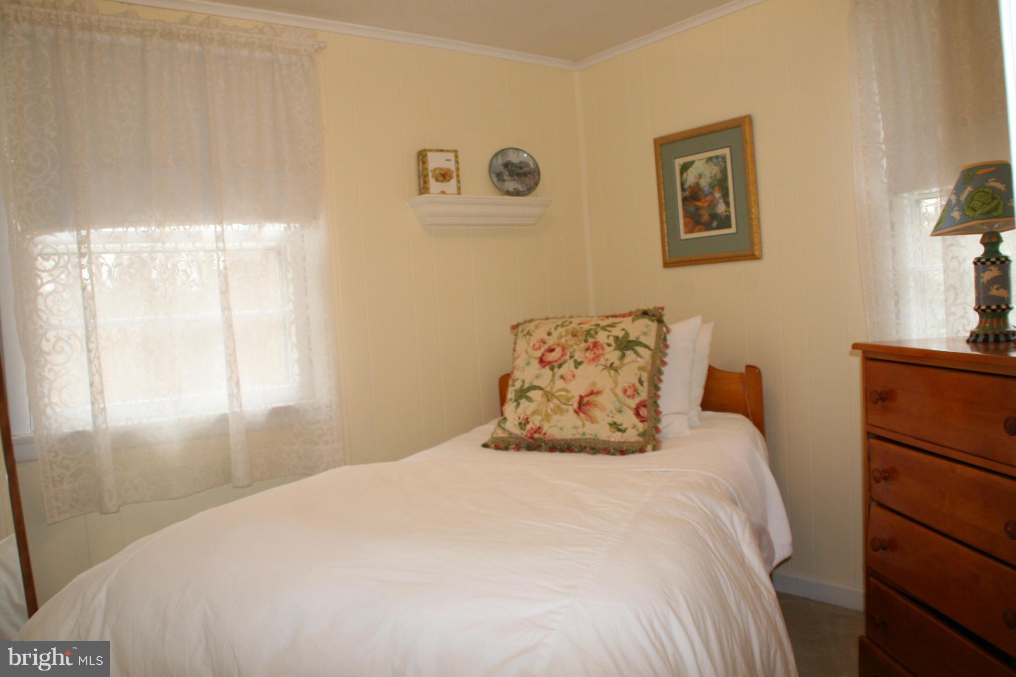 6606 Howellsville Road Front Royal, VA 22630 - Photo 17 of 30 a bedroom with a bed and a window