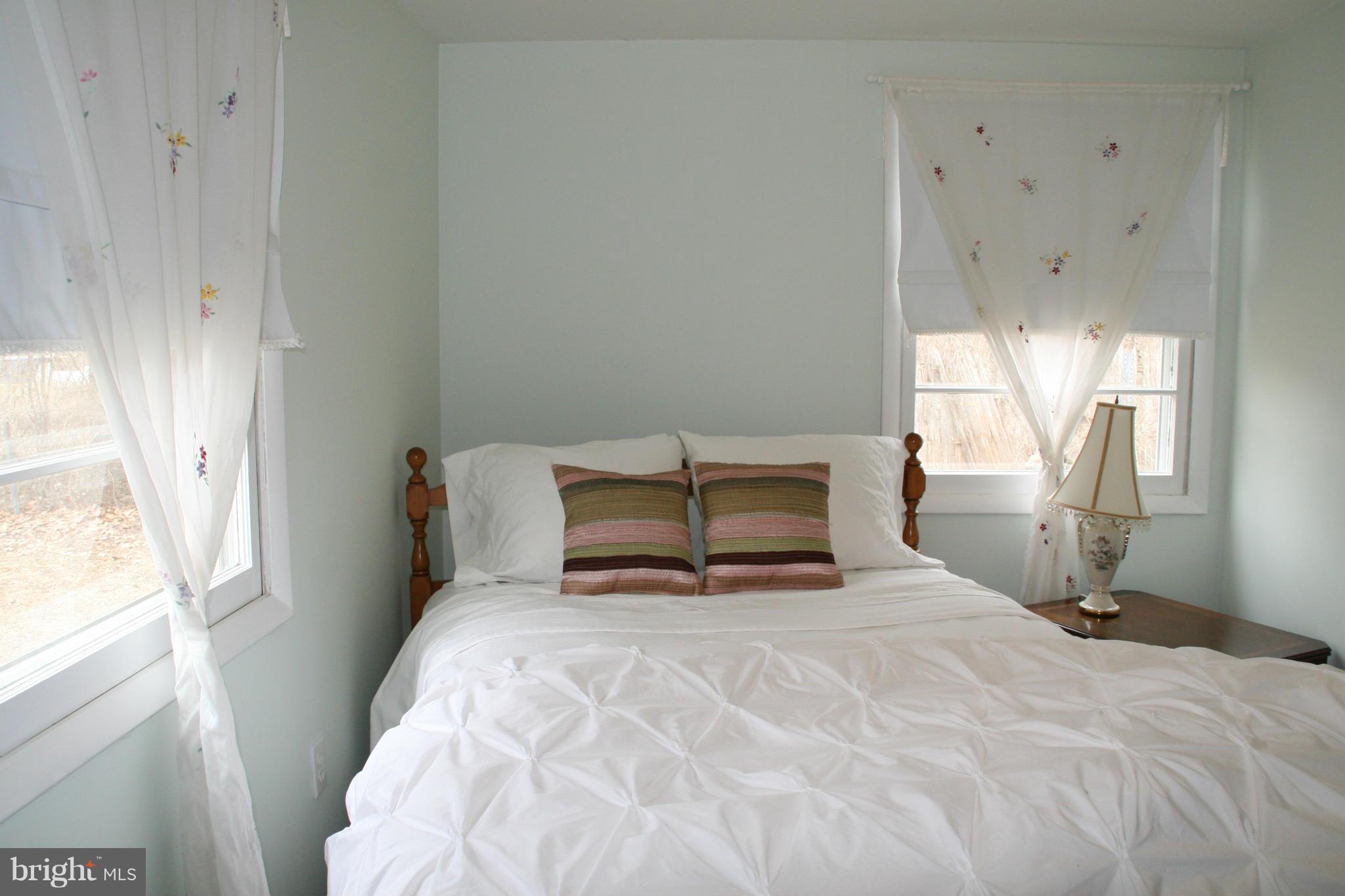6606 Howellsville Road Front Royal, VA 22630 - Photo 19 of 30 a bedroom with a bed and window