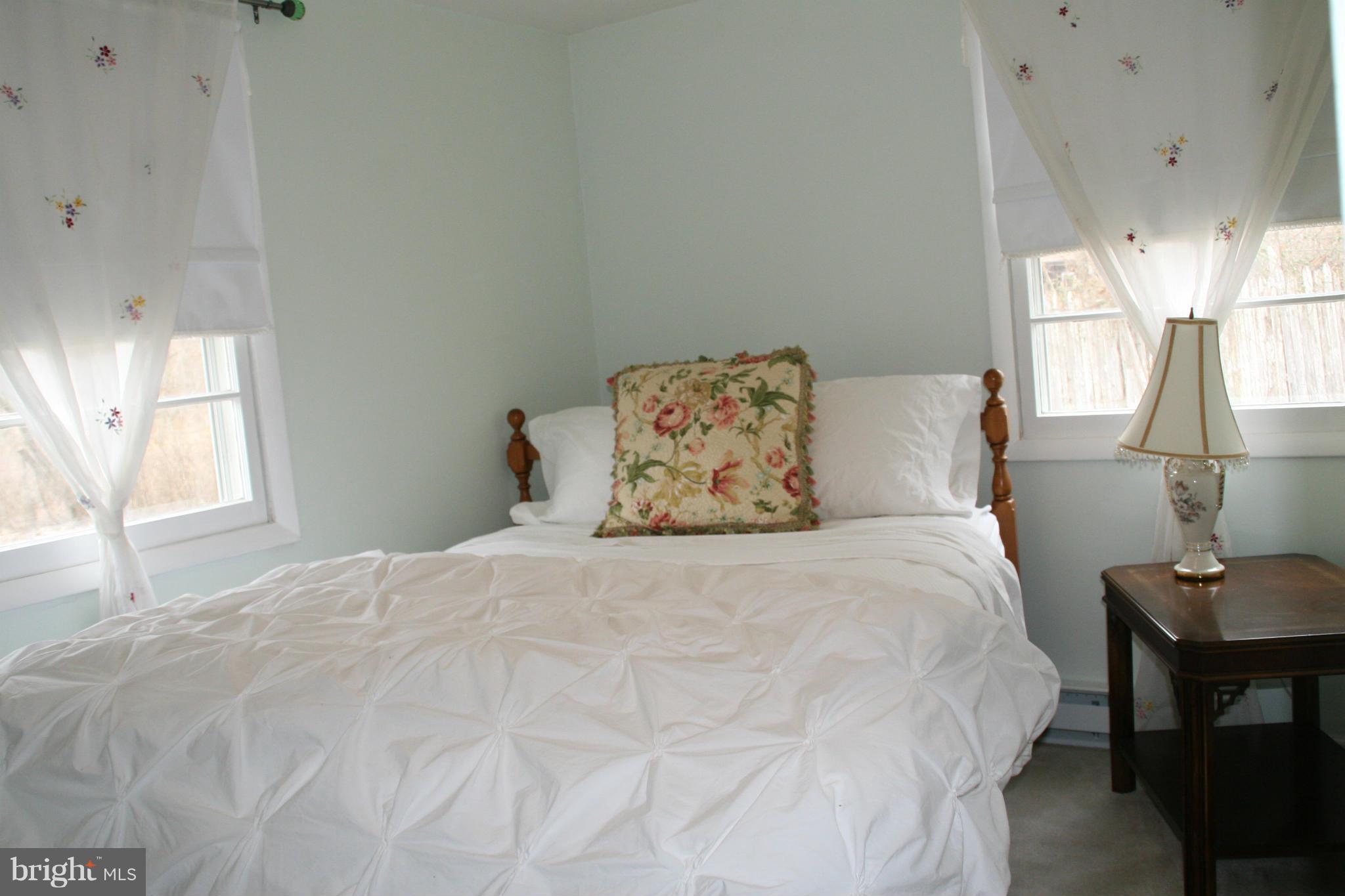 6606 Howellsville Road Front Royal, VA 22630 - Photo 21 of 30 a bedroom with a bed and a table