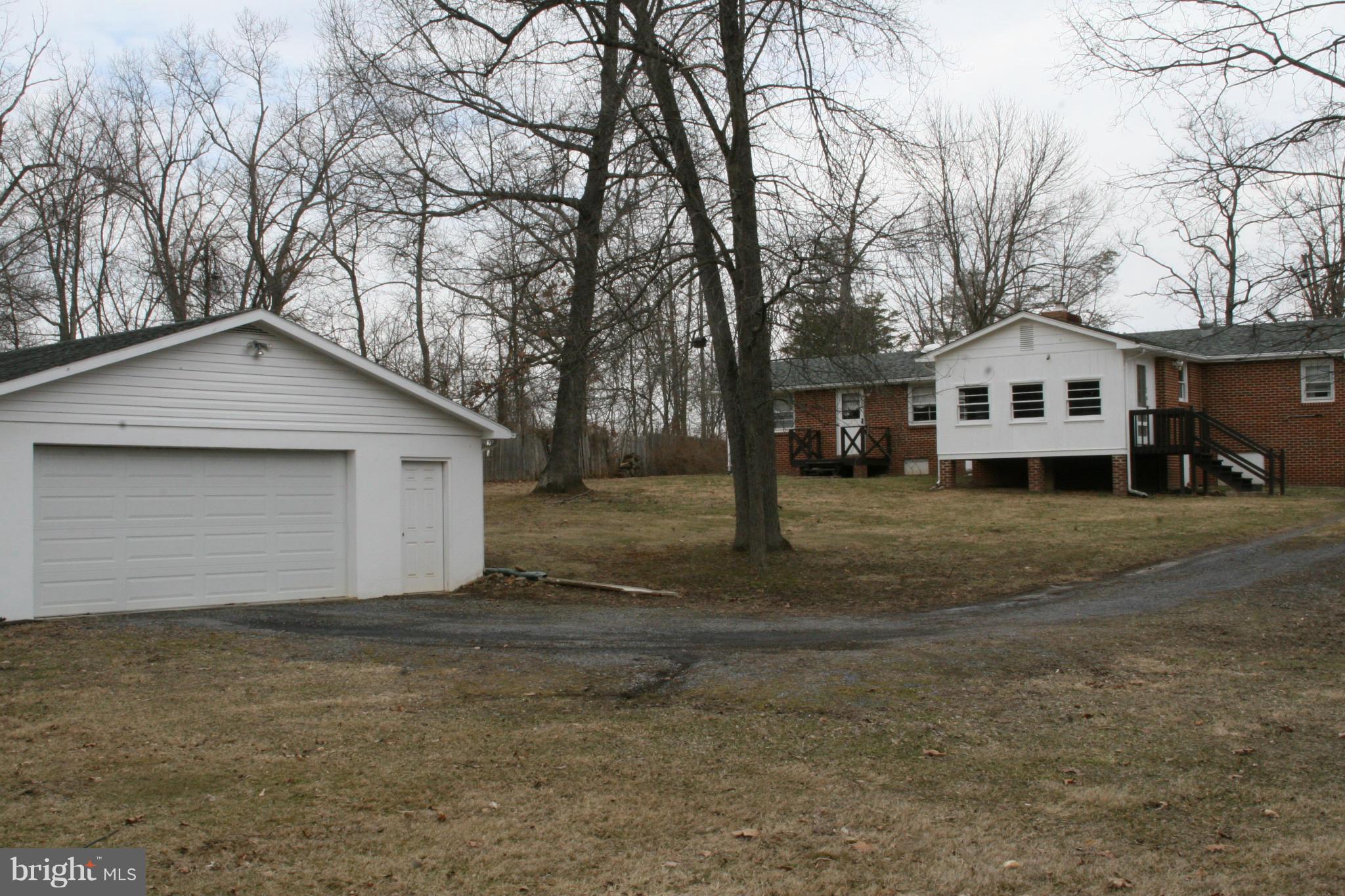 6606 Howellsville Road Front Royal, VA 22630 - Photo 30 of 30 a front view of a house with a yard and garage