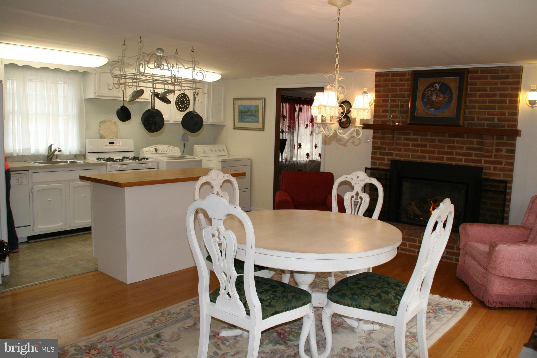6606 Howellsville Road Front Royal, VA 22630 - Photo 7 of 30 a view of a dining room with furniture and chandelier