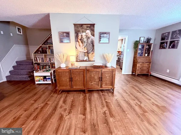 a room with wooden floors and furniture