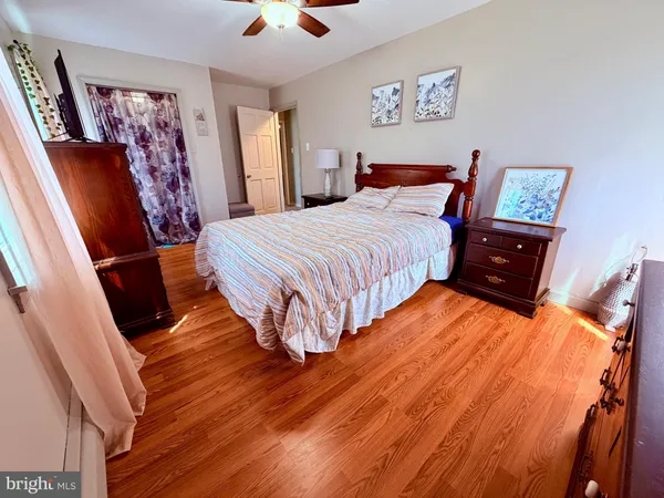 a spacious bedroom with a bed and furniture